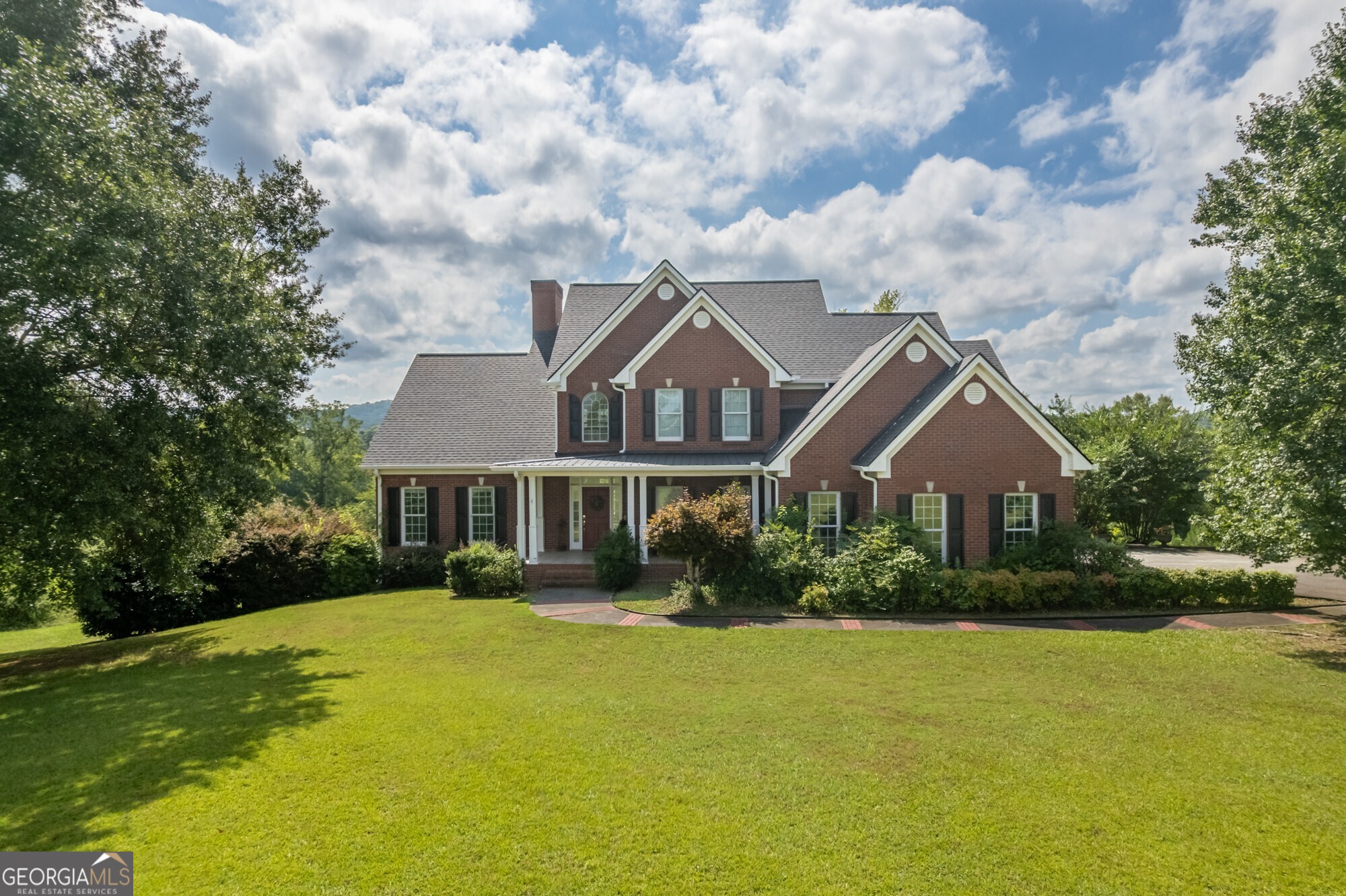 Luxury Country Retreat- Horse Farm- Check out this 4 sided brick home nestled on approx 40 Acres on Morgan Valley Rd, Rockmart GA, This beautiful home has 3 Bedroom/2.5 Bath's with huge spacious rooms through out, Living Room with tall ceilings w/Fireplace,Seperate dining room, Kitchen with solid surface counters, custom cabinets, breakfast area overlooking back yard,Master suite on main floor with large master bath w/garden tub with jets for relaxing,2 Bedrooms & large bonus room/4th bedroom share full bath upstairs, 2 sets of stairs to access upstairs.Main level also has large laundy room and office right off the kitchen area. This property also has a full unfinished basement for storage or could be finished for additional space. Property offers fencing for horses and barn, Completely private asphalt driveway leads back to a private oasis.