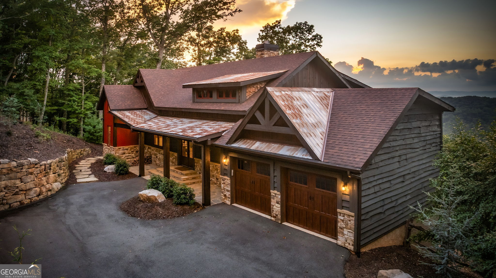 Discover your perfect mountain escape with this stunning 4-bedroom, 4.5-bath cabin, offering breathtaking layered views of the Blue Ridge Mountains. Merging sophisticated design with a profound connection to the natural surroundings, this residence provides an elevated lifestyle that balances modern comforts and rustic charm. The heart of the home is a spacious, open-concept kitchen, outfitted with top-of-the-line Viking appliances and accented by striking stone details that add warmth and character. A convenient butler's pantry offers extra storage and hides appliances, making entertaining seamless and keeping the space organized. The impressive stone fireplace acts as a captivating centerpiece, inviting relaxation and gathering while large windows frame the panoramic mountain vistas-allowing you to enjoy nature's ever-changing beauty. Begin each day waking up to awe-inspiring views from the primary suite, which features a luxurious spa-like bathroom with a massive wet room, a soaking tub, and dual walk-in closets, creating a private retreat to unwind and recharge. The lower level maximizes space & versatility, with soaring ceilings and abundant room for recreation and downtime. It boasts a second fireplace, a sleek wet bar, and two en-suite bedrooms, offering privacy and convenience for guests. A specially designed bunk room, complete with four built-in beds, provides endless fun and a perfect hideaway for children or additional visitors. Both levels open to outdoor living spaces featuring fireplaces-ideal for cozying up on cool mountain evenings or enjoying outdoor gatherings throughout the year. Practical details include a spacious parking pad, a two-car garage, and a thoughtfully built shed for storing tools and outdoor equipment, with extra storage above the garage for additional needs. This fully furnished and move-in ready home presents an outstanding opportunity for year-round living or a lucrative short-term rental investment!