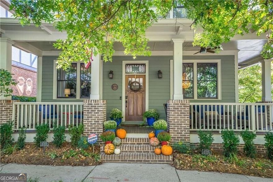 Nestled in the heart of Glenwood Park, this rare find pairs true Intown living with the comforts of a spacious suburban home, minus the yard work. The main residence offers 4 bedrooms and 3.5 baths with a coveted primary suite on the main level complete with its own private laundry. An open, light-filled floor plan flows effortlessly from the chef's kitchen to a beautifully landscaped courtyard, perfect for dinners and weekend gatherings and the wrap-around porch is made for morning coffee or sunset cocktails. Upstairs, generous secondary bedrooms and additional laundry make everyday living easy. A partially finished basement (plumbed for a future bath) and a hard-to-find 3-car garage deliver storage and flexibility galore. Need more space or versatility? An attached ADU/in-law suite features a studio layout with a full kitchen and bath, ideal for guests, multigenerational living, a private office, or potential RENTAL! Living in Glenwood Park means a true live-work-play lifestyle with the Atlanta BeltLine at your doorstep, beloved restaurants, bars and shops just steps away, and community events all through the year such as the Glenwood Park Halloween Parade, the holiday tree lighting in Brasfield Square, Parktoberfest in Brewer Park and the annual Easter Egg hunt, just to name a few. Optional neighborhood pool & gym membership, a private dog park, and community gardening plots round out the amenities.  Schedule your private tour today and experience Glenwood Park living at its best.