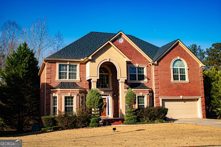 Back on the market at no fault of the seller. The buyer's financing fell through!  This original owner, 5 bedroom, 4 full bathrooms, move-in ready home is in the highly coveted luxury neighborhood of Mccart Landing offering a sanctuary of sophistication and modern luxury!! The 2-story family room creates an ambiance of warmth and splendor. Hardwood floors pave the way to the expansive kitchen, adorned with granite countertops, a custom-tiled backsplash, an enormous kitchen island, a pantry, and top-of-the-line stainless-steel appliances. The main level opens to a private patio that overlooks the lush backyard. The main floor is also graced by a guest suite, complete with a full bath and a walk-in closet, offering unparalleled comfort to visitors. The owner's suite is a sprawling retreat, featuring a spacious sitting room and an ensuite that defines indulgence. The second floor also has three additional bedrooms, two full baths, a laundry room, and an extensive catwalk creating an atmosphere of grandeur and opulence. The partially finished basement is a great space for entertaining and includes a finished theater room and built-in bar area. Beyond the private haven, McCart Landing beckons with community amenities, including a pool, clubhouse, and tennis courts, ensuring a lifestyle of leisure and recreation. Located mere minutes from I-20 access, this residence seamlessly combines opulence with accessibility, making it the epitome of luxurious living, sophistication, and elegance.