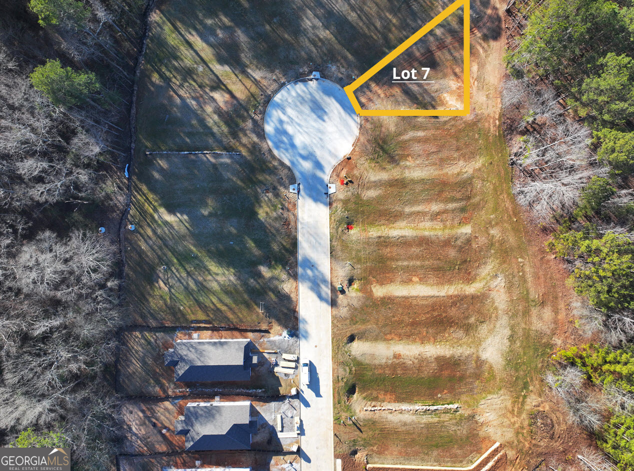 Rivers Edge is located just a stone's throw from Downtown Franklin, GA and the Chattahoochee River. This is Lot 7. This community is conveniently located to major cities such as LaGrange, Carrollton, and Newnan, GA. This property is planned for public sewer & water, as well as paved driveway. Lot purchase must accompany a contract to build a home. With multiple plans to choose from, you're sure to find your dream home! See standard disclaimers in attached documents. Contact Listing Agent for more details.