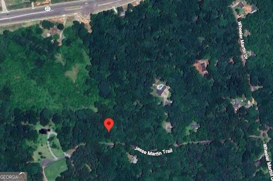 This is the opportunity you've been waiting for!! Over 4 acres, zoned AG, in Cherokee County. Great location, great schools, and an amazing piece of property. With over 700' of road frontage, this property is truly unique. Gently sloped and plenty of places to build. Located just east of 575 and south of highway 20; but feels like you're a world away with the privacy that this lot offers. You don't see parcels this desirable come on the market very often. Plenty of room for 2 homes with the current zoning. County water is available nearby. Lovely neighborhood and a fantastic location. Easy to walk. Sign is placed in the approximate center of the road frontage. Please call before showing.