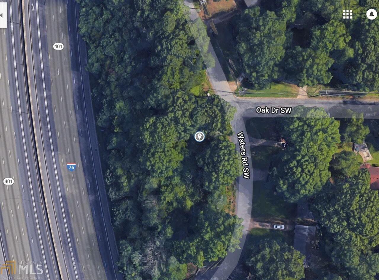 BELOW MARKET! Wooded lot ready for development at a great price. Visibility to I-75.