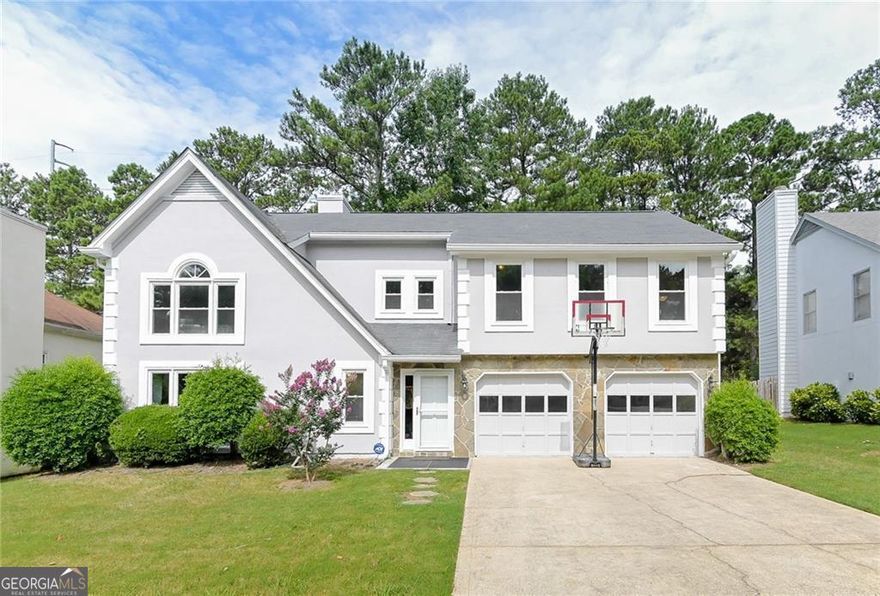 Welcome to 4180 Pineset Drive! This charming 3-bed, 2.5-bath, 2,457 sq ft North Atlanta home offers comfort and convenience.  Step into a light-filled retreat with an inviting foyer, open living/dining areas, and hardwood floors. The chef's kitchen features granite, stainless steel, and a breakfast nook.  Upstairs, the oversized primary suite boasts vaulted ceilings, a large closet, and a luxurious ensuite. Two additional bedrooms offer flexible space.  Enjoy a private, level backyard and an attached two-car garage. Freshly painted with new carpet, this home is meticulously maintained