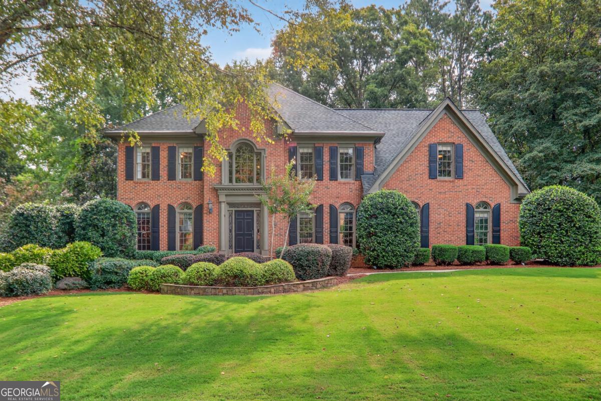Tucked away on a quiet street in one of Roswell's most welcoming neighborhoods, this 5-bedroom, 4.5-bath home is made for family living. With over 5,100 square feet of thoughtfully designed space, it's where everyday comfort meets neighborhood charm. The heart of the home is the kitchen that extends into a casual dining area with the living room just beyond. Step right out onto the deck overlooking the private wooded backyard, the perfect spot for morning coffee, weekend grilling, or keeping an eye on the kids at play. Upstairs, the primary suite feels like a retreat with a recently updated spa like bathroom consisting of heated floors throughout. The secondary bedrooms are roomy and light-filled with newly refinished bathrooms. The finished terrace level is a true extension of the home, complete with its own bedroom, bath, and second kitchen, plus plenty of room for movie nights, game days, or sleepovers. Outside, the .8-acre lot is built for adventure and connection: a wide front yard, wooded area with a creek to explore, and a fire pit ready for marshmallow roasts under the stars. Life here extends beyond the property line, too. This vibrant HOA community offers a pool, clubhouse, playground, and year-round activities, creating an instant network of friends and neighbors. Add in the top-tier schools, and you've found the perfect place to put down roots.