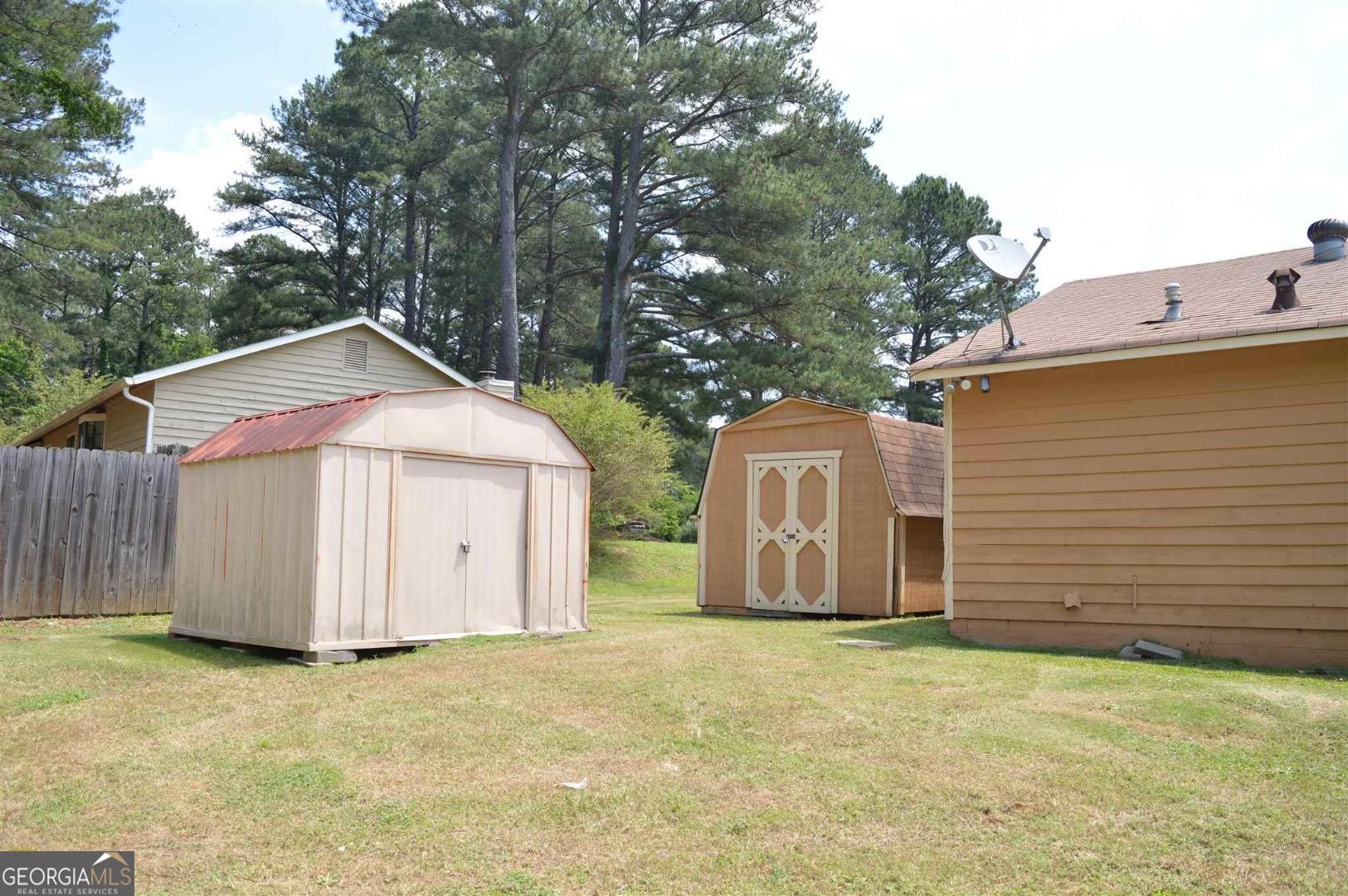 Make This Space Your Own! Charming 3 bed, 2 full bath ranch-style home on a spacious corner lot with full fencing for privacy and play. Enjoy a brand-new kitchen featuring updated cabinets, countertops, and appliances-ready for your culinary creations! Two outbuildings provide ample storage for tools, toys, or hobbies. Don't miss this inviting home with room to grow!