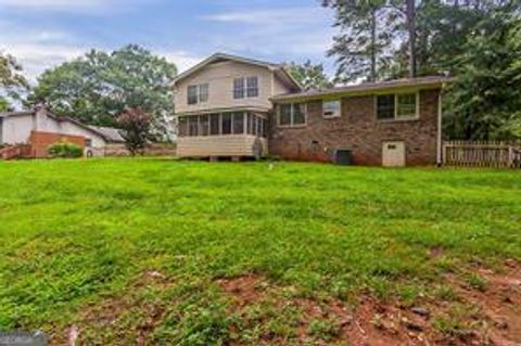 Photo of 4722 Kenneth Drive SW, Lilburn, GA 30047 (MLS # 10696424)