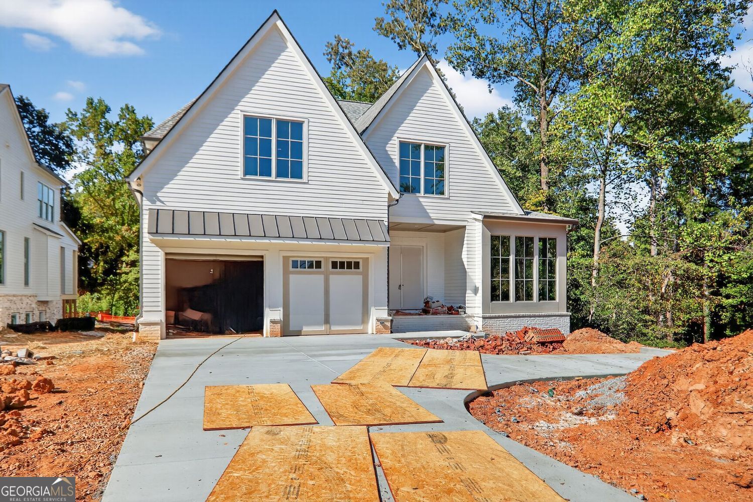 Last 2 homes available in Millgrove, Bedrock Homes newest project in Chamblee set for Mid November completion. Thoughtfully designed floor plans and custom-curated finish specifications. All 3 homes are under construction with planned closing dates in October. Front elevations boast a blend of brick, stone and smooth siding with light color schemes and soft warm tones. Open and functional interior spaces brightened with large windows and slider doors. The homes feature 10 foot ceilings on the main floor and 9 foot and vaulted ceilings on the upper. Full guest suites, mudrooms and powder rooms on the main levels in addition to walk-in pantries, entertainment bar spaces, and a full JennAir appliance packages including a 42" built-in refrigerator. Covered back porches offer a 2nd fireplace and overlook wonderfully landscaped backyards with privacy fencing. The owner's suites feature vaulted ceilings, separate tubs, walk-in showers and 2 generously-sized closets. Wide plank white oak flooring throughout with tile in the full baths and laundry. Full, daylight basements provide almost 2000 additional square feet for future finish. Easy access to incredible dining options, shopping, grocery, highways, Chamblee Rail Trail and Sexton Woods tennis courts, playground and other amenities!