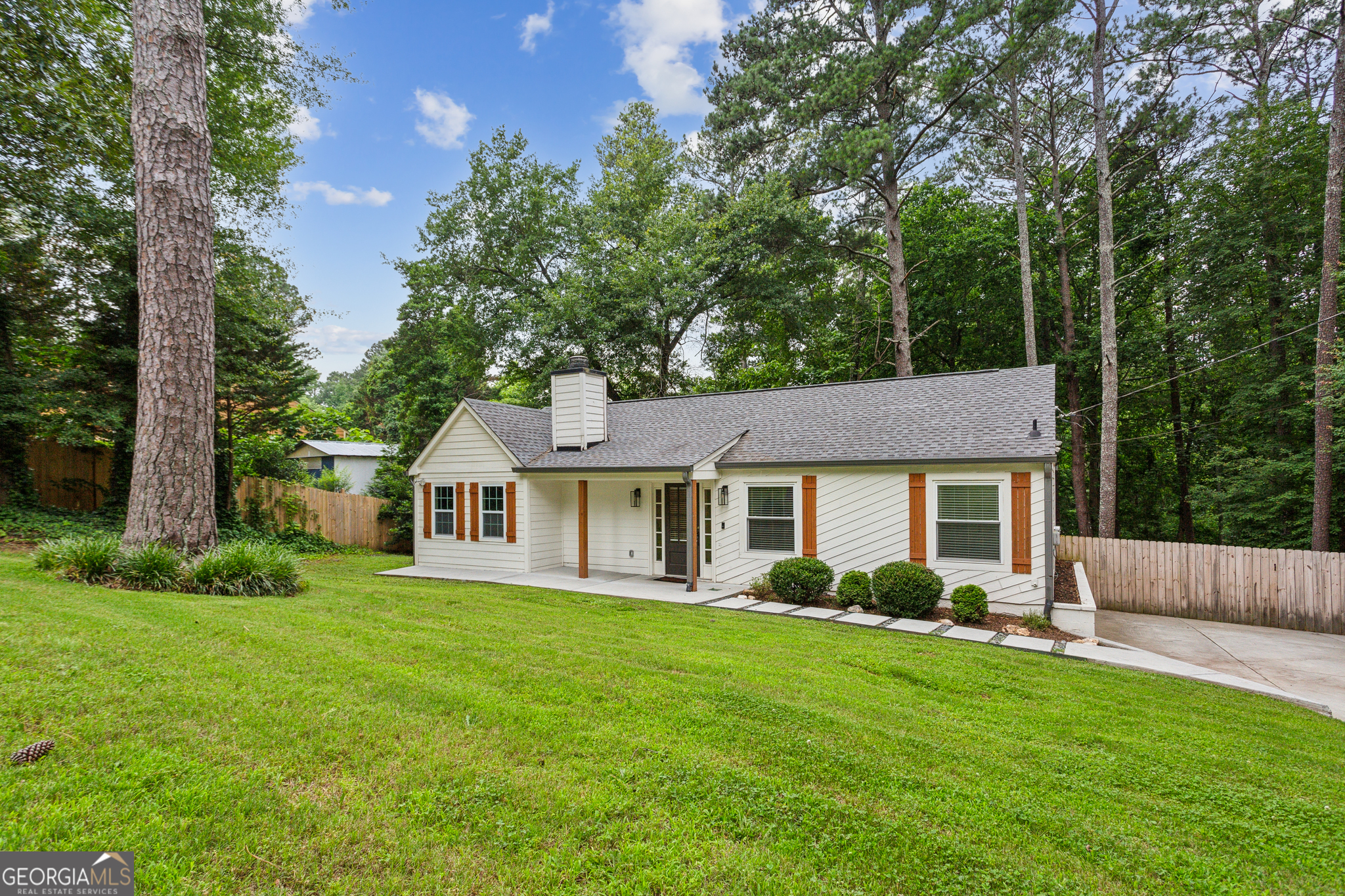 Welcome home to this recently remodeled three bed, two bath traditional ranch in the quiet Woodstock neighborhood of Applewood. Nestled on a half-acre lot, this charming home is ready for you to move right in. Updated features include fresh interior and exterior paint, new quartz countertops and white shaker cabinets in the kitchen, stainless steel appliances, updated bathrooms, new hvac, and new water heater. Enjoy visiting with guests in the open and airy living room offering vaulted ceilings and a beautiful stone fireplace. The large, fenced-in back yard includes a deck, two storage sheds, and plenty of room for children and/or pets to play. Very convenient to nearby schools, shopping, and downtown Woodstock!