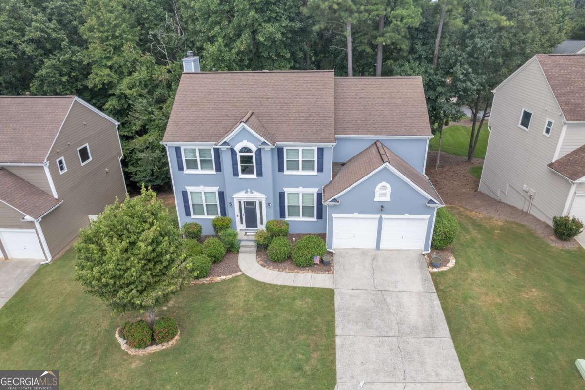 Location Location Location !! Look no further. This spacious 4BR/3.5BA w/ a Full Finished Basement has more to offer than you would imagine. Home sits at the end of the street, just before a cul-de-sac on a private wooded lot. A two-story foyer opens to a bright, airy family room with a wall of windows and cozy fireplace. Main-level office with French doors, hardwood floors, and fresh neutral paint. Kitchen features white cabinetry, center island, gas range, walk-in pantry, and plenty of room for entertaining. It's ready for your personal touch. Oversized primary suite with tray ceiling, garden tub, and separate shower; secondary bedrooms with double vanity bath. The finished terrace level offers natural light, media room, wet bar, sleeping quarters, and full bath. Perfect for entertaining or multi-generational living. Relax on the oversized deck overlooking the wooded backyard. Swim/tennis community in top-rated Chattahoochee & Findley school district. A short drive to downtown ATL, Buckhead, Midtown, a Getaway to Lake Lanier or the North Ga Mountains. You're also Minutes from Emory Hospital, Avalon, Halcyon, Medley at Johns Creek, Big Creek Greenway, parks, shopping, gyms, dining, and much much more ... Come See It while it's Still Available !!