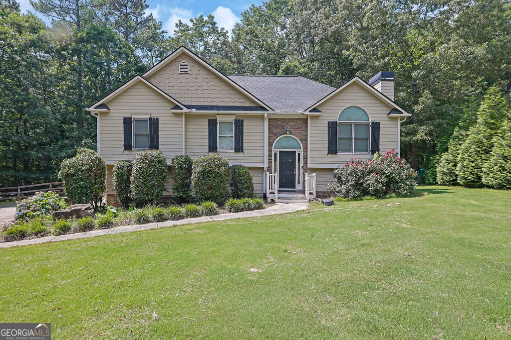 Amazing Gem just minutes from the City of Ball Ground!! Nestled on a 1.19-acre lot that sits within a cul-de-sac. This 3-bedroom/3-bath split-level home has been very well maintained and is move-in ready and maintenance-free. The lower level has an additional 2 rooms and an extra full spa-like renovated bathroom. Roof is less than 2 years old, Water heater is less than 2 years old, new carpet, new flooring, fresh paint throughout the home, Hardy Plank siding, separate living & dining room, vaulted ceilings. Wait until you see the amazing fenced-in backyard with plenty of driveway space.