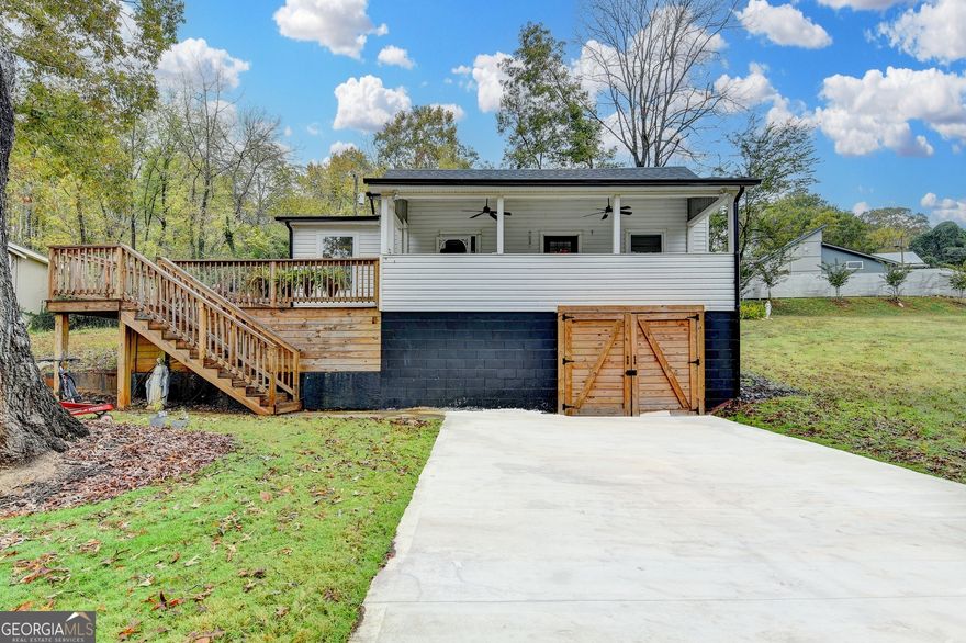 Come see this fully renovated home. It has 2 bedrooms and 2.5 bathrooms. It is beautiful and meticulously renovated. It is move-in ready and sought after in Ball Ground. This .50 acre wooded lot on a corner offers privacy and amazing views with a secluded backyard that brings the outside in! The back of the property offers a great area for tranquil relaxation and fun recreation! All close to downtown Ball Ground, shopping, restaurants, I-575, parks and venues! This location offers a small town rural feel with modern conveniences nearby! Home boasts a new, spacious outdoor enthusiast. Walk-in to this home from a level, enjoy a bright, updated kitchen with freshly painted soft close cabinets, new lighting, stainless appliances and an oversized farmhouse sink. Eat-in kitchen overlooks a spacious  porch for relaxing and enjoying the outdoors. Oversized owner's suite boasts  an area ideal for home office or a reading/relaxing nook. ! This is the perfect place to call home!!!   SPECIAL THANKSGIVING BONUS IF CLOSED BY NOVEMBER 25TH, 2025.