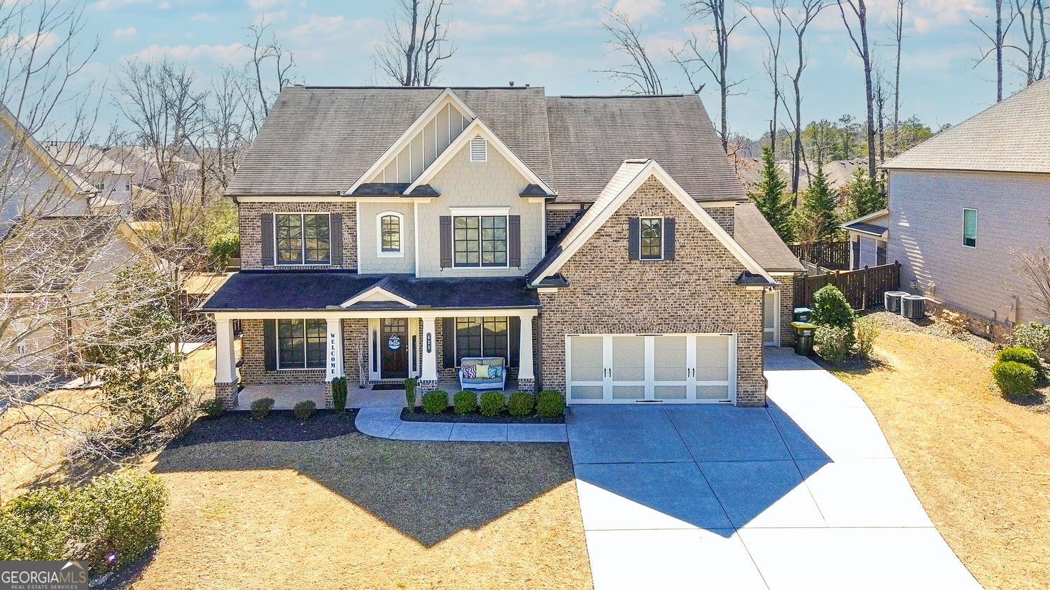 Welcome to the Brookwood Plan, an exquisite home designed for comfort and luxury. This thoughtfully laid-out residence features a variety of amenities and spaces perfect for both family living and entertaining. Features include: Bedroom on the main level with a full bathroom; ideal for guests or flex space. Stylish great room with fireplace and coffered ceiling open to kitchen area perfect for mingling. Truly a chef's kitchen with oversized island with seating area as well as a breakfast area which takes you to the outdoor living area. High end countertops for durability and elegance; 36" gas cooktop, providing precise temperature control for cooking. Vent hood vents to outside for a fresh cooking environment. Stylish tile backsplash that adds a decorative flair and undercabinet lighting. 4 additional bedrooms on the upper floor each with access to their own bathrooms. Home also offers an additional large elevated flex space perfect for theater room; play room, exercise room or whatever suits you. Owner's suite is designed for relaxation and comfort; Spa bath features a garden tub, seamless glass shower, double vanities, private water closet and oversized walk in closet. Three car garage to house your 4 wheeled babies. Fabulous outdoor living with a covered patio that includes a cozy fireplace, perfect for gatherings or quiet evenings. Private backyard provides a serene space for outdoor activities, gardening, or simply unwinding in nature. Great location just minutes from everything...shops, GA400 and award winning schools.