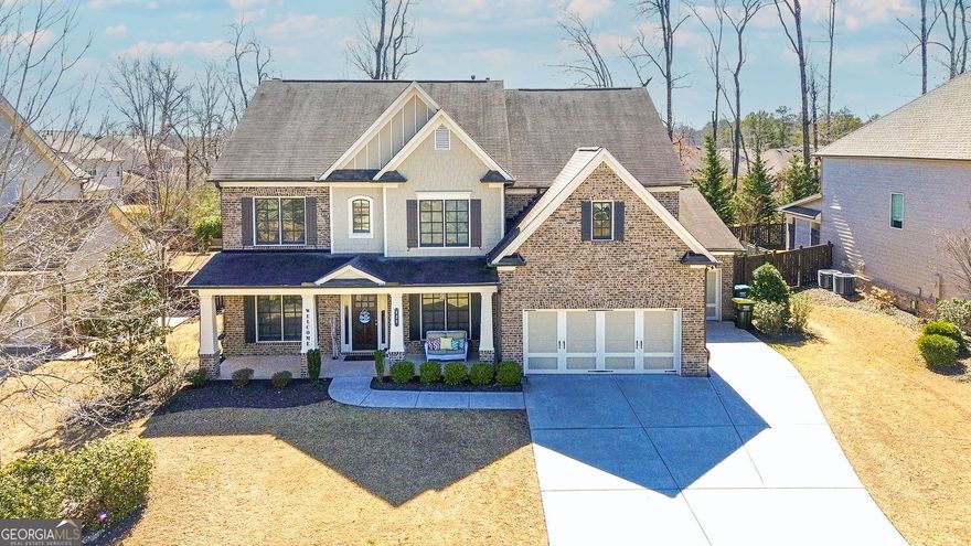 Welcome to the Brookwood Plan, an exquisite home designed for comfort and luxury. This thoughtfully laid-out residence features a variety of amenities and spaces perfect for both family living and entertaining. Features include:  Bedroom on the main level with a full bathroom; ideal for guests or flex space. Stylish great room with fireplace and coffered ceiling open to kitchen area perfect for mingling. Truly a chef's kitchen with oversized island with seating area as well as a breakfast area which takes you to the outdoor living area. High end countertops for durability and elegance; 36" gas cooktop, providing precise temperature control for cooking. Vent hood vents to outside for a fresh cooking environment. Stylish tile backsplash that adds a decorative flair and undercabinet lighting. 4 additional bedrooms on the upper floor each with access to their own bathrooms.   Home also offers an additional large elevated flex space perfect for theater room; play room, exercise room or whatever suits you.   Owner's suite  is designed for relaxation and comfort; Spa bath  features a garden tub, seamless glass shower, double vanities, private water closet and oversized walk in closet. Three car garage to house your 4 wheeled babies. Fabulous outdoor living with a covered patio that includes a cozy fireplace, perfect for gatherings or quiet evenings.  Private backyard provides a  serene space for outdoor activities, gardening, or simply unwinding in nature. Great location just minutes from everything...shops, GA400 and award winning schools.