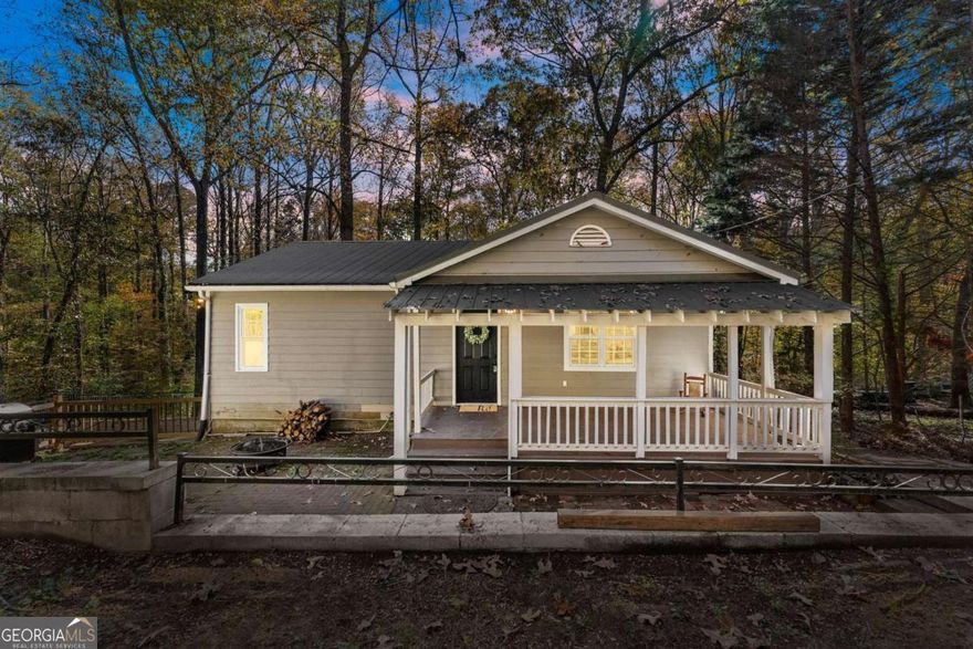 Welcome to 6315 Eidson Drive - where charm, comfort, and possibility come together. Tucked in a quiet neighborhood in Cumming and located in the highly desirable, award-winning Forsyth County School District, this inviting 3 bedroom, 2 bathroom home offers the cozy feel of country living while still being close to Lake Lanier, shopping, dining, and GA-400. Step inside to a welcoming living area with natural light and an easy flow into the dining and kitchen spaces. The kitchen features granite countertops, ample cabinet storage, and prep space, making it perfect for everyday meals and weekend hosting. You'll love the large bonus room that can easily function as a 4th bedroom, playroom, home office, media room, or whatever your lifestyle calls for. Enjoy mornings on your rocking chair front porch and peaceful evenings in the spacious backyard - there's room to garden, play, relax, or expand. The oversized parking pad makes it easy to host family, friends, and gatherings - no tight squeeze here! Bonus Feature: A second structure sits behind the home offering endless possibilities - workshop, studio, storage, hobby space, or even future guest/teen suite conversion. With no HOA, you'll have the freedom to make this property truly your own. This home is full of potential and offers exceptional versatility - ideal for first-time buyers, those looking to downsize, multigenerational living needs, or even investors seeking a promising opportunity. 6315 Eidson Drive is truly one you don't want to miss.