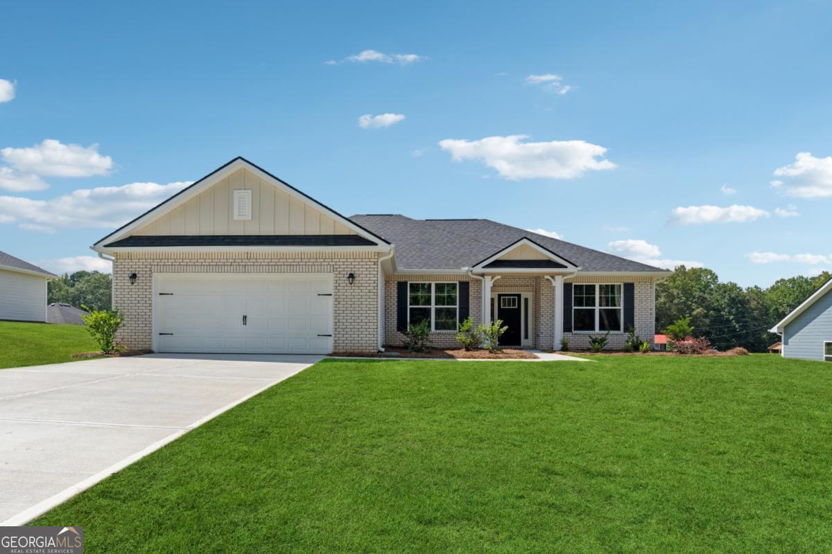 Welcome to this "Park Place Sanctuary" - A Bright and Vibrant - 3 Bedroom / 2 Bed - Ranch Retreat in the Park Place community! Envision waking up in your 1826 sq. ft. dream home in Park Place, affectionately known as "The Friendly City", Bowdon, GA. A bright and breezy floor plan perfect for laid-back living, tucked into the heart of a community that feels like home from day one. Natural light fills the walk-in foyer and dining room, leading into the great open-concept family room, with the elegance of a electric fireplace to just unwind from a long day or a romantic evening. The kitchen hosts a gorgeous granite countertop island awaiting your gourmet meal prep and a pantry just waiting to be filled. This beautiful split-bedroom layout offers 2 spacious secondary bedrooms and a full bath as you walk into the hallway. The amazing owner's suite has a luxurious soaking tub, a separate shower, and a walk-in closet. This thoughtfully designed space offers both privacy and connection, creating the perfect atmosphere for modern living. Picture yourself unwinding on your covered lanai, overlooking a peaceful and spacious backyard for outdoor living and family barbeques. Whether hosting lively gatherings or enjoying a quiet evening, this home is designed to enhance every moment of your life. Built for quality and efficiency, "The Park Place Sanctuary" features architectural shingles for durability and two water heaters to ensure lasting comfort and peace of mind. you'll enjoy natural light throughout the day, making every room feels warm and inviting. Situated in Carroll County, minutes from I-20, local Bowdon schools, Tanner hospitals, and the University of West Georgia and West Georgia Technical College along Georgia State Routes 100 and 166, Bowdon combines small-town charm with convenient access to nearby communities, local downtown restaurants, and boutique shops. Near Carrollton Greenbelt walking trails, Little Tallapoosa, Hays Mills, and John Tanner Parks, great for outdoor life, hiking, biking, walking, boating, and fishing. USDA financing eligibility, and only $1,000 in earnest money required, making homeownership affordable and attainable. This is your opportunity to own a residence that perfectly blends style, efficiency, and affordability. Schedule your private tour today and start making memories in "Park Place Sanctuary."