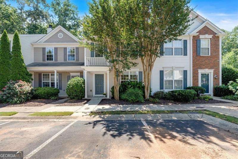 Welcome to this beautifully maintained 3 bedrooms, 2.5 bath townhome located in one of Alpharetta's most desirable communities. Offering the perfect blend of style, comfort, and convenience, this home is filled with natural light and thoughtful updates throughout. The main level features an open-concept layout with a spacious kitchen showcasing granite countertops, stainless steel appliances, and a cozy breakfast nook. The dining area flows seamlessly to a private patio through secure double French doors with built-in blinds, overlooking a peaceful wooded backdrop perfect for outdoor dining or relaxing. A convenient outdoor storage room adds extra functionality. Freshly painted throughout, the interior feels bright and inviting. Upstairs, you'll find new flooring and a spacious primary suite complete with a large walk-in closet and private bath. Two additional bedrooms share an updated full bath and a convenient laundry room. Situated in a top-rated school district and just a few minutes from Downtown Alpharetta, Avalon, Windward Parkway, GA-400, shopping, dining, and parks, this home offers unmatched convenience in a serene setting. New Roof and Gutters (2023) and New HVAC (2024). A rare opportunity to own a beautifully updated townhome in the heart of Alpharetta.