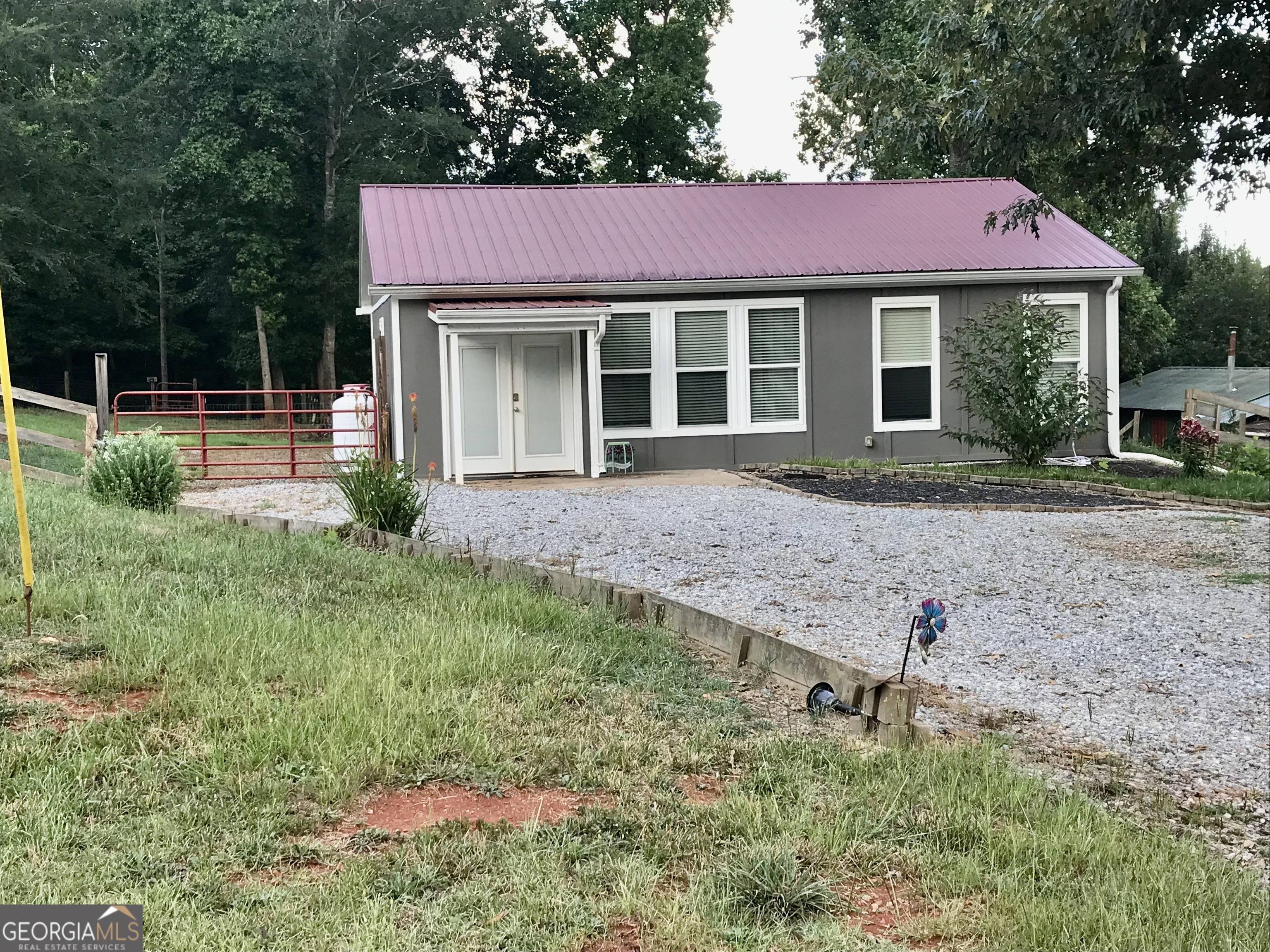 Cottage in Lake Hartwell community, within walking distance to Lake Harbor Shores family park, lake access, boat ramp for smaller recreational watercraft and covered grilling and picnic pavilion. One bedroom cottage on double lot, 0.58 acres total. Camper with attached deck can be purchased with property on a separate BOS. Large shed can easily house additional guests with addition of stand alone window AC and heating unit. Very quiet area with room to expand to meet your needs.