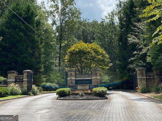 Beautiful 5.07 acre lot ready to build your dream home nestled among million dollar homes. This lot is close to Atlanta Yacht Club, Park Marina on Red Top Mountain, Cherokee and Cobb county line, walking trails, Hwy 75 and 92 and the Lake. This lot has not been approved for subdividing. There are no "For Sale" signs on this property. Please do not walk this property without prior approval.