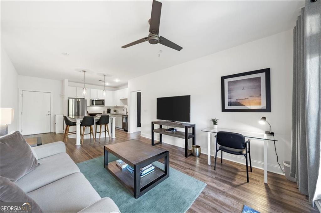 Live TALL in this fully furnished, light and bright 1-bedroom 1-bath Grant Park condo steps to the beltline and Farmer's market. The white kitchen features classic shaker cabinets, stainless appliances, and a massive island that comfortably seats four. The sizeable open floor plan offers clear views from the kitchen through the living room and onto the private balcony. The bathroom hosts a soaking tub, separate shower, and laundry closet. The impressive owner's suite boasts a fashionista-sized closet and a wall of windows. Fresh paint throughout. One assigned parking space. Enjoy a modern workout facility, a fun-filled common area/ game room, and plenty of on-street parking. This condo boasts a secured gated parking lot and code required for building entry. Grant Park is the most desirable of the East Atlanta intown neighborhoods schedule a viewing ASAP!