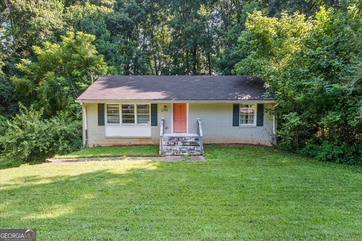 Here we go with an intown investor opportunity in the highly sought after Medlock Park neighborhood of Decatur. Either go all in on sweat equity and turn this into your own home or renovate and sell this one for a nice profit. You get an all brick built home with hardwood floors throughout the main. And you also already get the open floor plan on the main, so no walls you have to tear down to create more sense of space. And, there are 2 rooms in the basement and a full bath waiting for your renovation and finishing. A nice, deep wooded lot makes this home an opportunity to potentially expand on and maintain plenty of yard to play with some woods to explore. This house also has a 1 car drive under garage you can keep as is or convert to make more living space. Lots of options here for the saavy investor in a nothing but increasing value neighborhood. Be close to Emory, City of Decatur without the city taxes and you can walk to Medlock Park's pool, playground, and baseball fields. And, if you love to take walks in the woods, look no further. Medlock Park neighbors enjoy the use of South Peachtree Creek Trail, a paved greenway connecting Medlock Park to Mason Mill Park, and various unpaved "social trails". The South Peachtree Creek Trail is part of the PATH Foundation network and features a boardwalk section. You also have direct access to Clyde Shepherd Nature Preserve and trails. Intown living that is steps away from nature. As Is Sale. Fryer Law Firm, downtown Decatur, is the preferred closing attorney and location. 404-240-0007