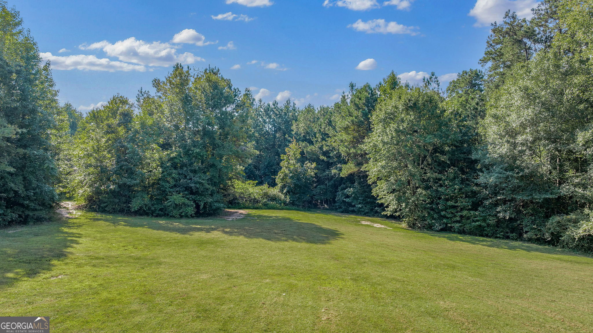 Don't miss this rare opportunity to own a beautiful 2-acre level tract in highly sought-after Jefferson, new Jackson County schools. This property features 268 feet of road frontage and is conveniently located to I85, Braselton, Athens, Gainesville. With NO HOA, this property offers the perfect spot to build your dream home! Enjoy a wonderful mix of open space and mature trees, surrounded by established homes and picturesque properties. Public water available, completed perc test, and a new survey-making it truly ready to build. Covenants will be attached to the deed to protect the integrity of the property (no mobile homes, no subdividing, residential use only). Bring your builder and your vision-this is the place you've been waiting for!
