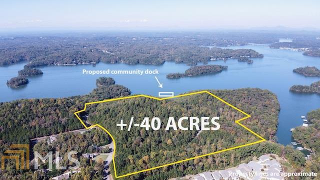 Lakefront Acreage- approximately 40 acres in Gainesville with 42 slip boat dock permit approved by USACE.  Adjacent to Creswinds community.   19 acre tract zoned PUD- proposed 540 condo units approved by city (case 89-23) in 1989.  23 individual lots included.  Proposed 540 unit blank cost is approx $26,000/raw unit. Please call agent for more information.