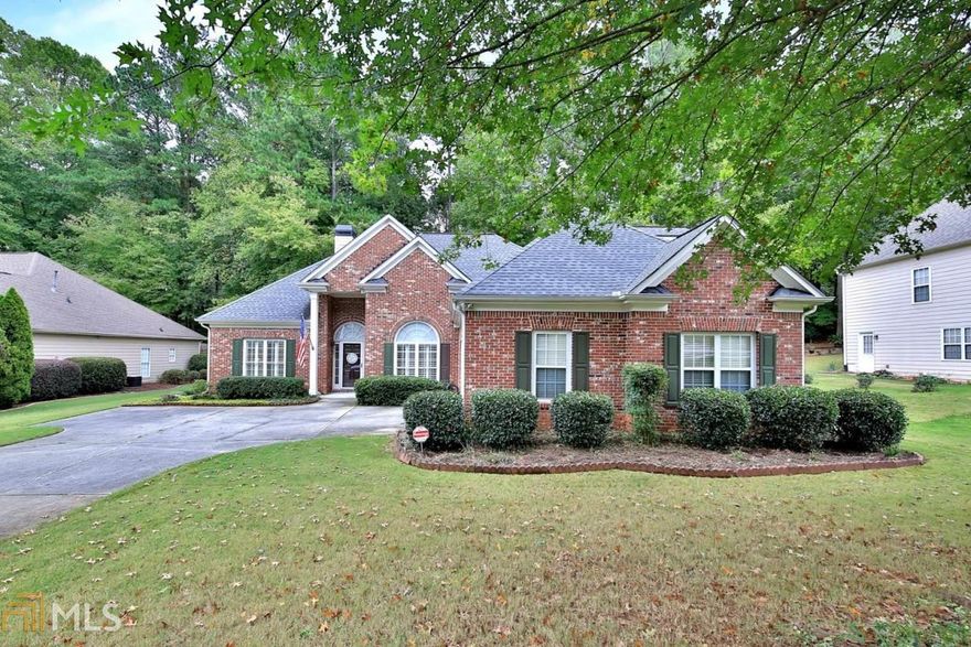 True One Level Living!  Lovely Brick-front Ranch Located In The Heart Of West Cobb.  Entry Foyer Opens To Formal Dining, Open Family Room Features Higher Ceilings, Romantic Fireplace w/Gas Logs, View From Kitchen To Family Room.  Breakfast Area Boasts View Of Lovely Fenced & Wooded Backyard.  Kitchen Features Granite Counter Tops, White Cabinets, Gas Range. Hardwood Flooring In Hallways, Kitchen, Breakfast Area & Foyer. Owner's Suite Is Large Size w/Trey Ceiling & More Nice Views Of Wooded Backyard, Soaking Tub, Separate Walk-In Closet.  Floorplan Is a Split Bedroom Plan w/2 Bedrooms Located On The Opposite Side Of The Home.  These Bedrooms Share A Bath.  There Is A Guest Suite Upstairs w/Full Bath, Walk-In Closet & Vaulted Ceiling.  Additional Features Include Newer Carpet, Plantation Shutters, Newer Roof, Fenced Backyard, Cement Siding, Storage Area In Garage, Small Crawl Space w/Storage.  Home Located Near A Cul-De-Sac.  Great School System!