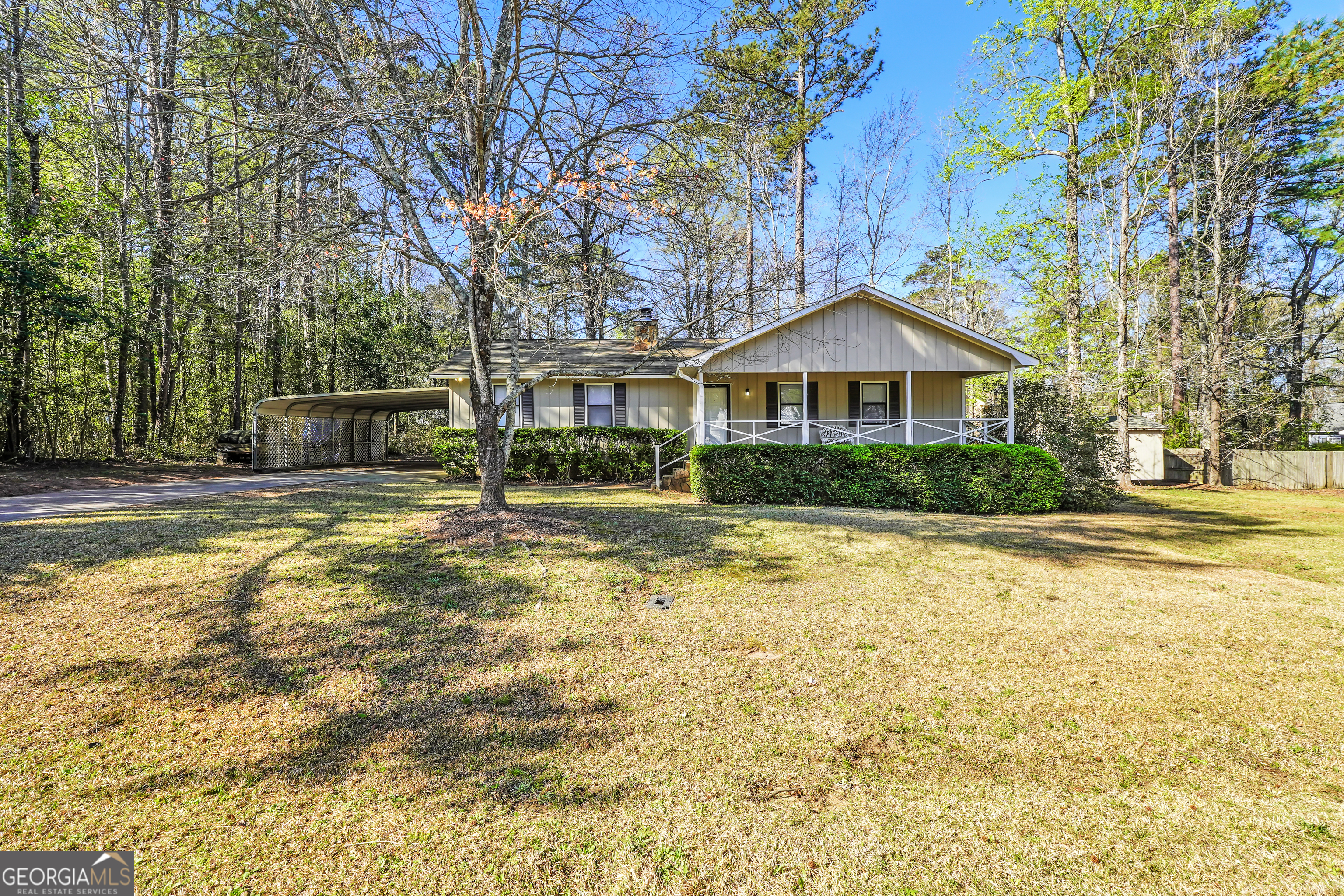 Charming 3 Bedroom, 2 Bath Home in Gated Lake Wildwood Community! Welcome to Lake Wildwood living in this beautiful 3-bedroom, 2-bath home with 1,541 sq. ft. of thoughtfully designed space. Enjoy your morning coffee on the rocking chair front porch before stepping inside to an open-concept floorplan with LVP flooring in the main living areas. The kitchen boasts white cabinetry, stainless steel appliances, and granite countertops, flowing seamlessly into the living and dining areas. The oversized master bedroom features new carpet, while the en suite bath offers a double vanity and a tiled shower. Step outside to your fenced backyard and relax on the rear screened-in porch-perfect for entertaining or unwinding. Two outbuildings provide additional storage or workspace. Enjoy the amenities of the gated Lake Wildwood community, including a lake, pool, tennis courts, and more. Don't miss this opportunity!