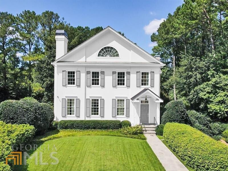 A Charleston-style front door serves as a charming entry to this meticulously crafted home tucked away on a quiet cul-de-sac in one of Buckhead's most popular neighborhoods. The freshly painted, light and airy interior features high ceiling heights, beautiful hardwood floors, dentil moldings and a host of other thoughtful details. A seamless flow between rooms on the main level provides an ideal setting for entertaining with a formal living room, large separate dining room, spacious kitchen with breakfast room and fireside family room leading out to the beautifully landscaped backyard with Koi Pond. Upper levels feature a spacious primary bedroom suite and five additional ensuite bedrooms. Daylight terrace level provides two additional living spaces, garage access and available workspace. Numerous recent upgrades include new HVAC systems on all three levels, a new water heater, and back-up generator. Sought-after location in Morris Brandon school district, minutes to Memorial Park and numerous world-class shopping and dining options in Buckhead and Midtown.