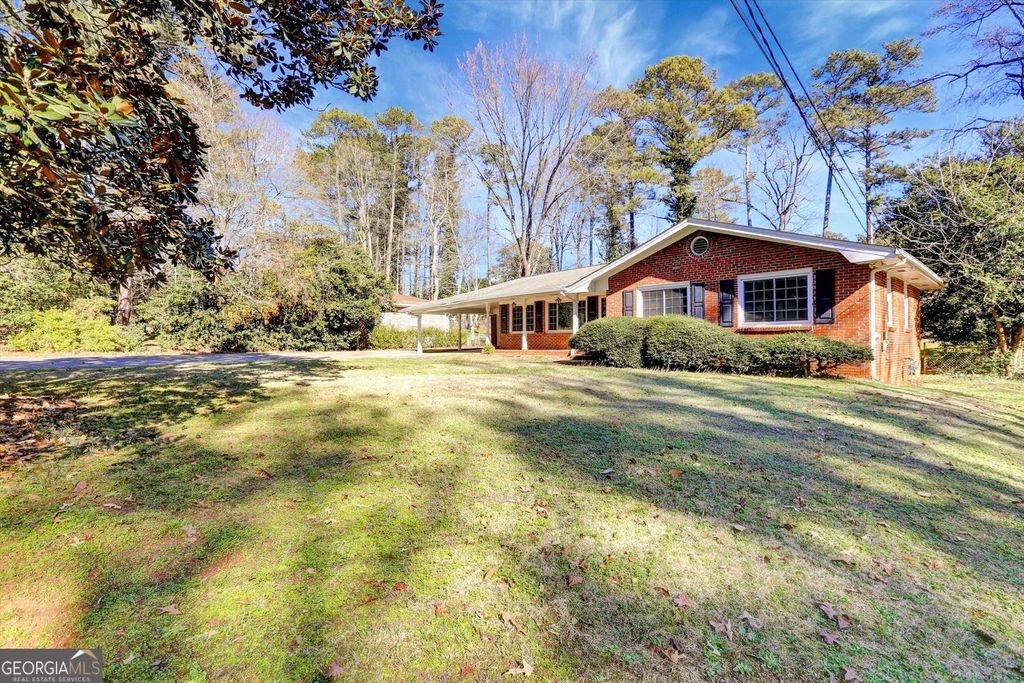 Photo of 1266 Hickory Drive SW, Lilburn, GA 30047 (MLS # 10674581)