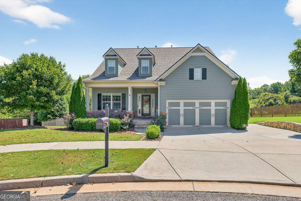 Enjoy cul de sac life in this great Braselton neighborhood!!! You can relax on the covered front porch or the amazing covered back porch overlooking greenspace & nature - The kitchen with island is adjoined to the great room and offers a perfect gathering area - Primary bedroom is on the main floor with luxurious bath including soaking tub - 3 additional spacious bedrooms upstairs - Basement has one finished room/office and is stubbed for an additional bathroom - LOCATION!! Just a few minutes from the Chateau Elan exit off of I-85, close to shopping and hospitals as well as easy access to I-985!! Don't miss this well maintained home ready for someone new to call it HOME!!