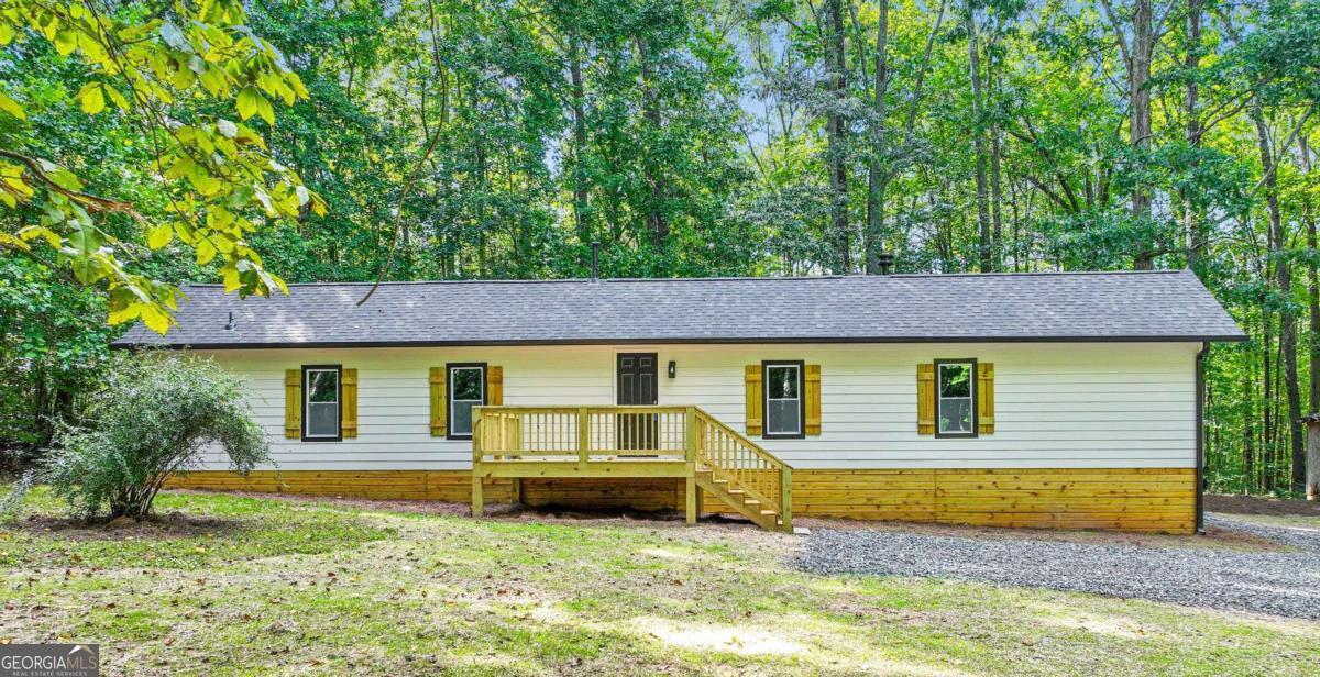 Welcome to your peaceful retreat! This beautifully updated 4-bedroom, 2-bath mobile home is nestled on 2.09 private acres, accessed by an 800-foot driveway that offers privacy and tranquility. Inside, enjoy a bright, open layout and living area. The kitchen features all-new appliances, perfect for everyday living or entertaining. Step outside to a brand new front deck ideal for relaxing and enjoying the quiet surroundings. Modern comfort meets country charm, move-in ready and waiting for you!