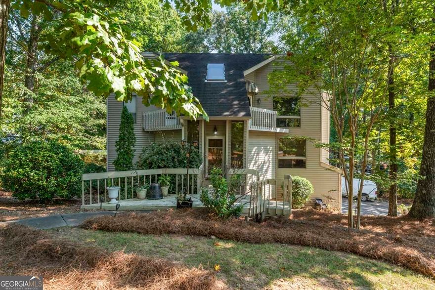 Welcome to your dream home in Marietta, Georgia! The kitchen is equipped with stainless steel appliances, making meal preparation a delight. The living room features floor-to-ceiling windows, flooding the space with natural light and offering picturesque views of the lush surroundings. Step outside to enjoy the covered deck, perfect for outdoor dining and gatherings.  This stunning property has an inground pool perfect for summer relaxation and a full finished basement ideal for entertainment or additional living space. This home combines luxury and comfort, providing an exceptional living experience in a sought-after location. Don't miss the opportunity to make this exquisite property your own!