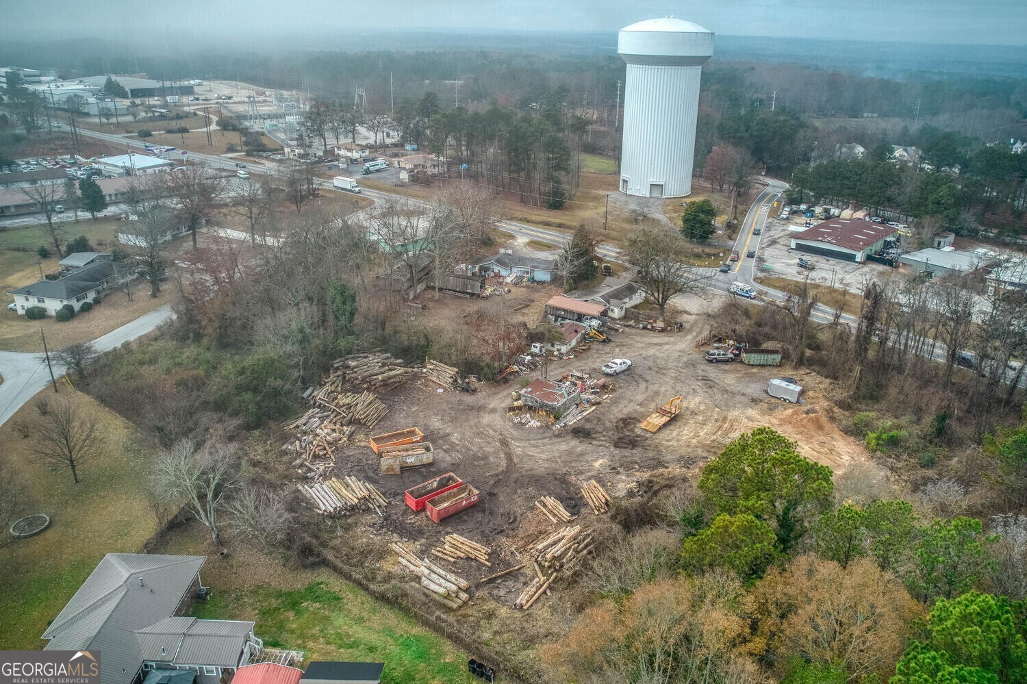 Exception 1.2 + acre heavy commercial property in prime Douglasville location with high visibility and multiple building options for retail, service, or industrial use! Discover the potential.