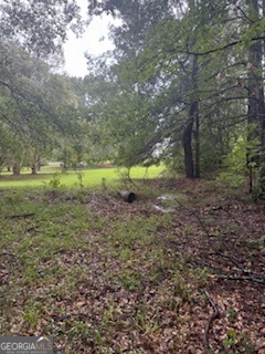 Nestled in a peaceful setting just minutes from town, this beautiful wooded lot offers the perfect balance of privacy and convenience. Surrounded by nature, yet close to shopping, dining and schools, it's the ideal location to build the home you've always envisioned. Whether it's a barndominium or spacious custom home, this property is a blank canvas ready for your plans.