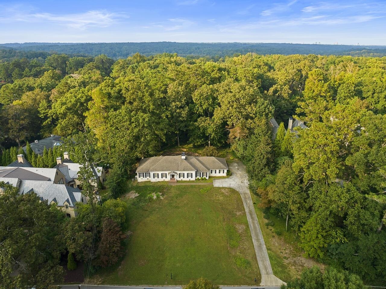 Excellent opportunity in the heart of Buckhead on 1.09 acres, great elevation and set back from the street. High ceilings, open floor plan, updated with perfect hardwood floors. Remodeled kitchen with all Viking appliances, remodeled bathrooms and HVAC systems. Family room with fireplace and french doors across the back that open to the brick patio. Plenty of room for a pool and private. Owner suite has 2 dressing rooms and large bathroom. Walk up attic. Downstairs has infrared sauna and plenty of storage. Dry not issues. Excellent condition. 2 car next to kitchen. Situated between $10M estates with private walk-out backyard which currently has a brick patio but is the perfect space for a pool. Very private. Great opportunity in the heart of Buckhead. Great location and so close to Whole Foods, shopping and the heart of Buckhead. This property is move-in ready. Systems have been updated, freshly painted, new hardwoods, high ceilings, 2 car garage, large kitchen and larger family room. Unlimited expansion possibilities with walk up attic and additional land all around the property.