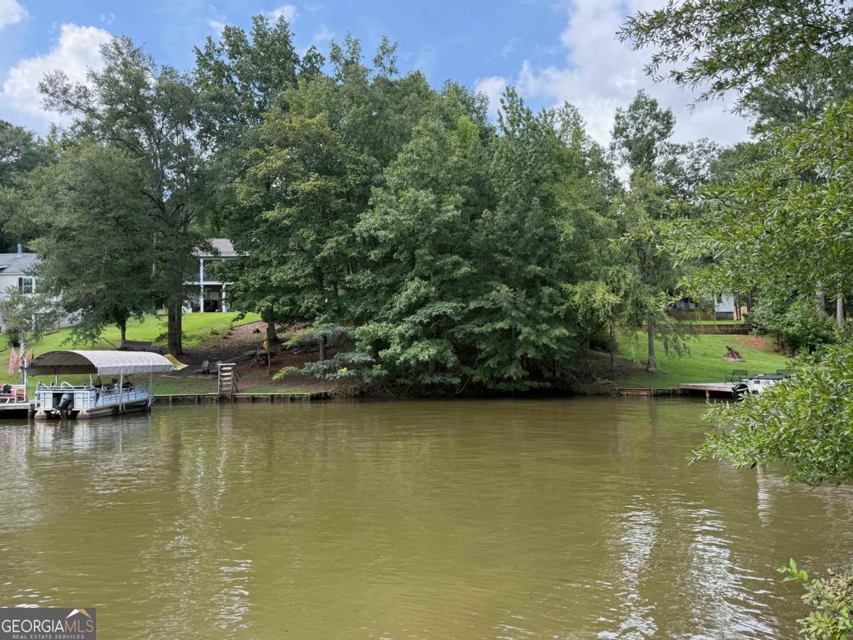 Fee simple Lake Sinclair lot. Gentle slope to water. Nice views. Great location. Undeveloped - No improvements. Unsure of exact amount of water front frontage. Great lot to enjoy the lake lifestyle experience!