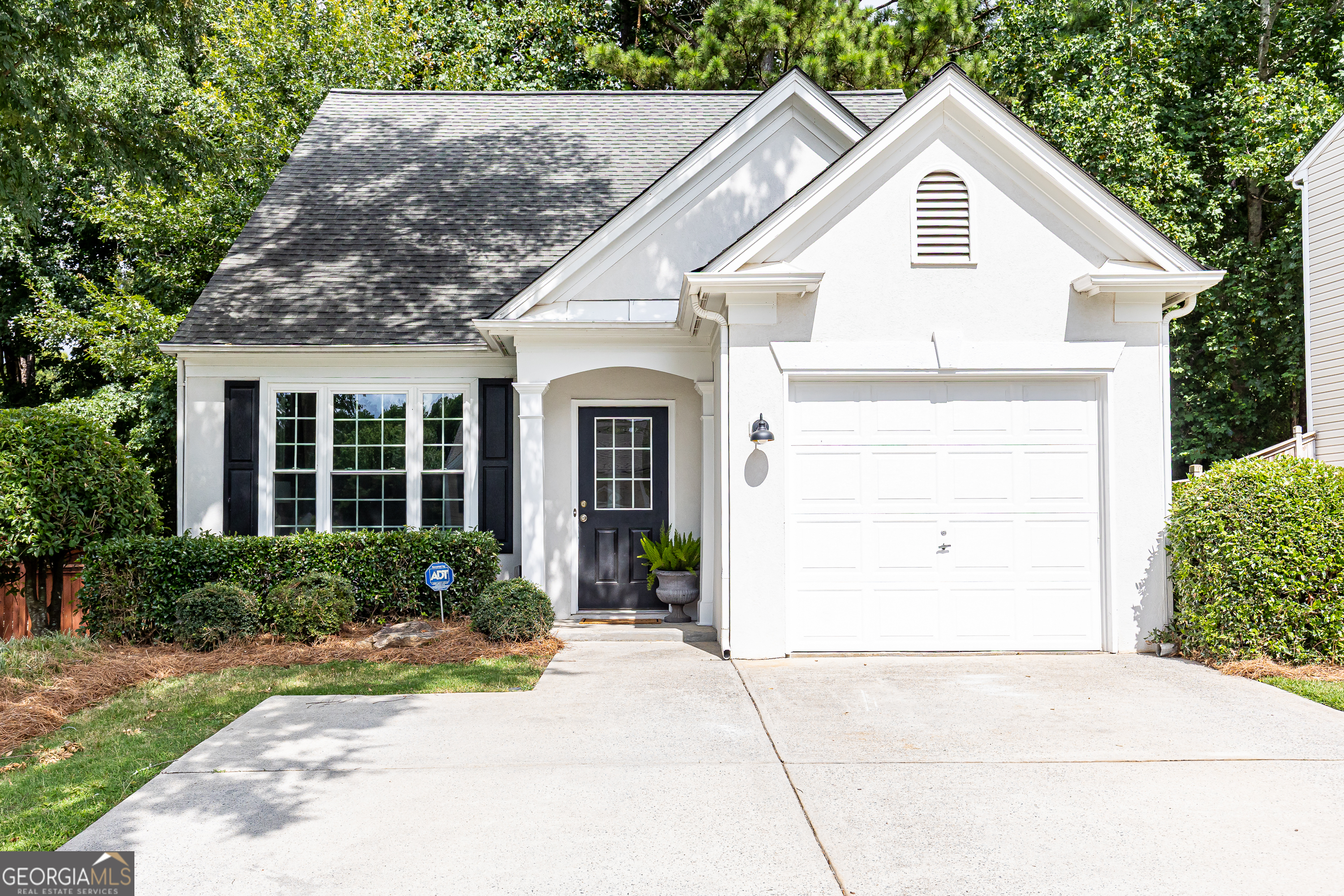 Prime Alpharetta Rental! This beautifully updated 3-bedroom, 2.5-bath home is tucked within a desirable swim community just minutes from top-rated schools, Avalon, Downtown Alpharetta, and The Greenway. The bright, open layout showcases a soaring two-story living room with a cozy gas fireplace, a dining area, and an updated kitchen with new stainless steel appliances. Stylish LVP flooring flows throughout the entire home, including the main-level primary suite with walk-in closet and easy access to the living space. Upstairs offers two additional bedrooms, a full bath, and a laundry room with extra storage. Thoughtful upgrades include a brand-new HVAC system, washer and dryer, toilets, recessed lights, ceiling fans, blinds and fresh paint throughout. A fenced, wooded backyard with a flat patio completes the home-perfect for outdoor living, relaxing, or entertaining.