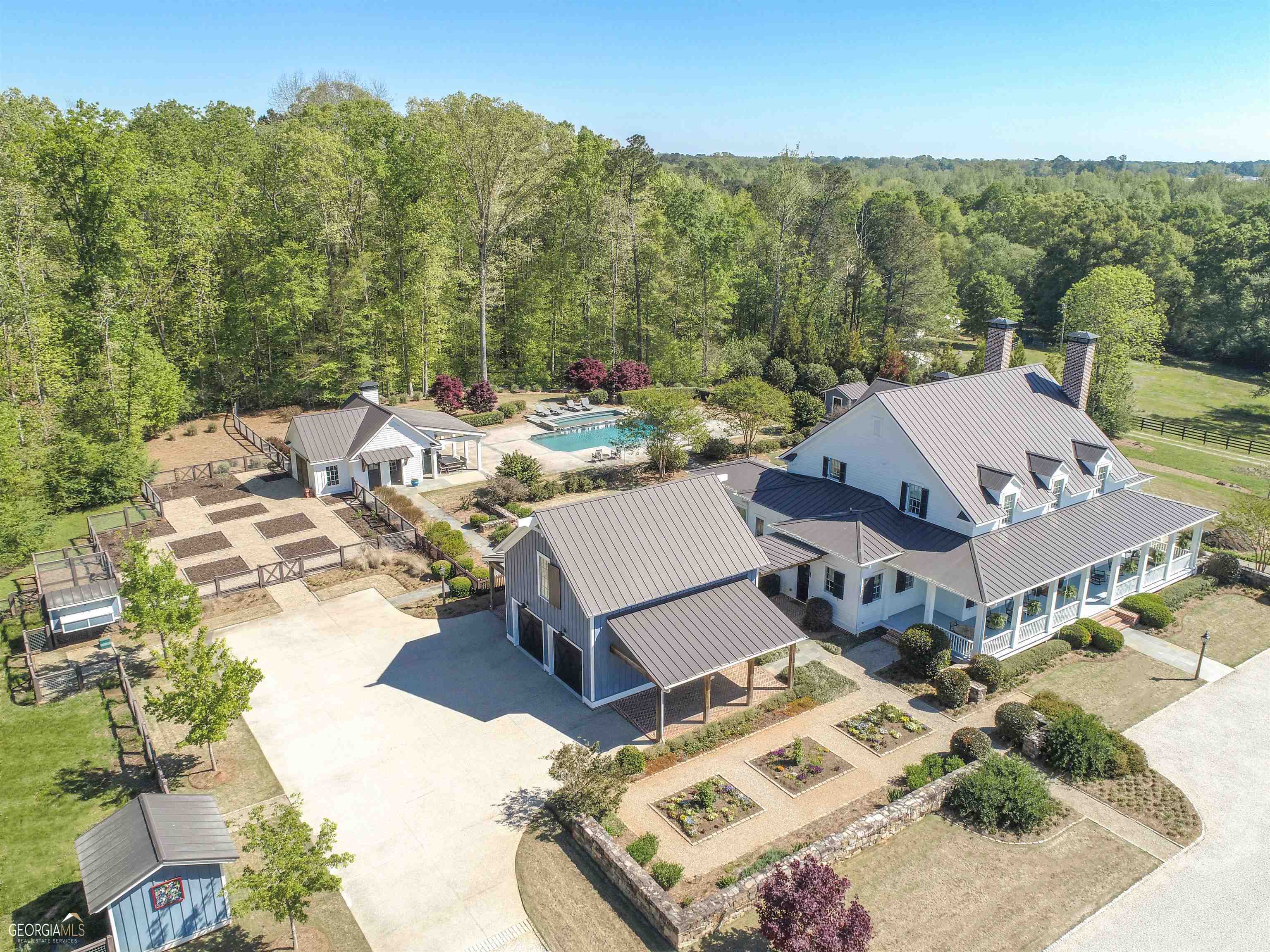 Absolutely stunning custom built farmhouse on 30 acres in the heart of Atlanta's South Side. Constructed in 2016 with over 6,400 sqft of living space this home truly defines farm life living with a custom and luxurious feel. This listing represents 3 parcels with 3 homes all included in this sale. Under Contract Prior to listing in GAMLS. (Tax Parcel IDs: 1346125022 / 1466132002 / 1456133005)