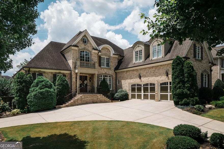 Graceful double door entry and unmatched craftsmanship throughout. This distinct 6-bedroom, custom home, features a dramatic floor plan ideal for grand-scale entertaining and spacious family living. Natural light fills the space, highlighting a striking wood beam cathedral ceiling and 3 fireplaces with many custom details. The chef's kitchen boasts Thermador appliances, premium cabinetry, a large island, dining area, and walk-in pantry. Main level boasts a wet bar, opening to a patio with Green Egg for outdoor cooking and entertaining. The terrace level includes a game room, 200-bottle wine cellar, fridge, dishwasher, spacious bedroom and custom-designed bar. Location has it all including quick access to main roads including I-75, on a quiet street at the end of the cul de sac, with a basketball court, Pool and premier East Cobb school district.