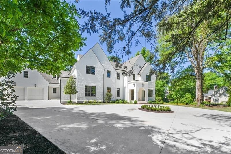 Discover the ultimate in modern living with this brand-new construction by Hask Construction, nestled in the heart of Buckhead. This residence embodies contemporary sophistication and spacious living. Step inside and be greeted by an exquisitely designed open floorplan. The beautiful foyer sets the tone, flanked by a stylish study and a formal dining room that seamlessly transitions into a gourmet kitchen. Revel in the culinary delights of custom cabinets and a top-of-the-line Wolf and Sub-Zero appliance package. A scullery, complete with a second dishwasher, Wolf oven, and microwave, provides ample storage and a discreet spot for your smaller kitchen essentials. The butler's pantry adds a touch of practical luxury with an ice maker and wine fridge, leading to a spacious dining room with serene views of the custom landscaping. The kitchen and breakfast area seamlessly connect to a relaxing keeping room with venetian plaster ceilings and custom doors that open to a covered patio with an inviting fireplace and access to a thoughtfully landscaped yard. The kitchen and breakfast area flow into a spacious family room anchored by a custom Francois fireplace. Accordion doors extend the living space to a covered porch, creating a serene atmosphere for gatherings. The primary suite on the main level is generously proportioned and offers a large custom closet, a spa-inspired bath, and a tranquil sitting area overlooking the private backyard. Upstairs, you'll find four spacious en-suite bedrooms and a substantial bonus area, ensuring ample living space for all. The outdoor area is designed for entertaining, featuring a sizable porch with a fireplace and access to a walk-out backyard with a pool and expansive green space. A rare four-car garage with additional living space above allows for customization, whether it be for an au-pair suite or a private home office. The partially finished terrace level offers a large recreation area and approximately 3000 sq/ft of adaptable space, perfect for a bedroom and full bath, home theater, bar, or indoor sports facilities such as a golf simulator.