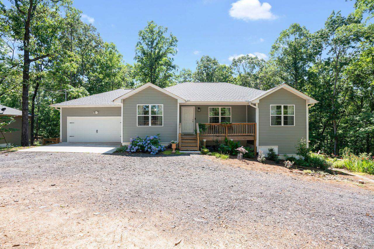 Better than new... built in 2019, Charming 4/3 Ranch Style Home on Finished Walk-Out Daylight Basement sitting on 3/4 of a wooded acre w/ NO HOA . Home includes a 2 Car Garage, Spacious Kitchen w/ Island featuring granite countertops, open concept w/ a view to the family room. Finished basement w/full in- law suite including kitchen, full bath & separate entrance to home. This could be the perfect income producing property w/ Airbnb potential. All 3 baths boasts granite countertops.This home gets the most amazing Sunrises & Sunsets ! The backyard is double fenced offering garden space, & ample room for kids & dogs to roam. Only 1/3 mile to Lake Lanier and Toto Creek Park w/ Boat Launch, Pic Nic Tables & Camping. Conveniently located minutes to Hwy 400, for all Shopping and Dining needs!