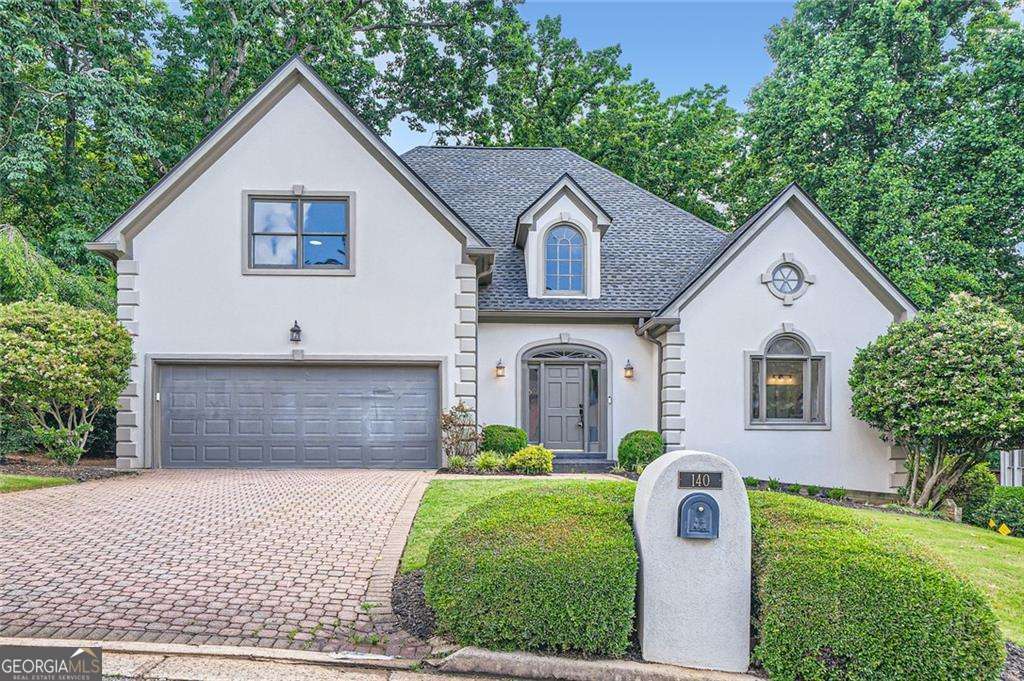 Welcome to this beautifully maintained traditional-style home nestled in an ideal Atlanta location. The spacious main floor features a warm and inviting family room with soaring cathedral ceilings, seamlessly flowing into a light-filled sunroom-perfect for relaxing or entertaining guests. A formal dining room leads into an eat-in kitchen with ample space for casual family meals. The oversized primary suite on the main level offers convenience and comfort, while two generously sized bedrooms upstairs share a Jack and Jill bathroom-ideal for family or guests. The finished basement offers incredible flexibility, with an additional living area, bedroom, full bath, and abundant storage space. Whether you're looking for a home office, media room, or guest suite, the possibilities are endless. Don't miss the opportunity to make this classic Atlanta residence your forever home!