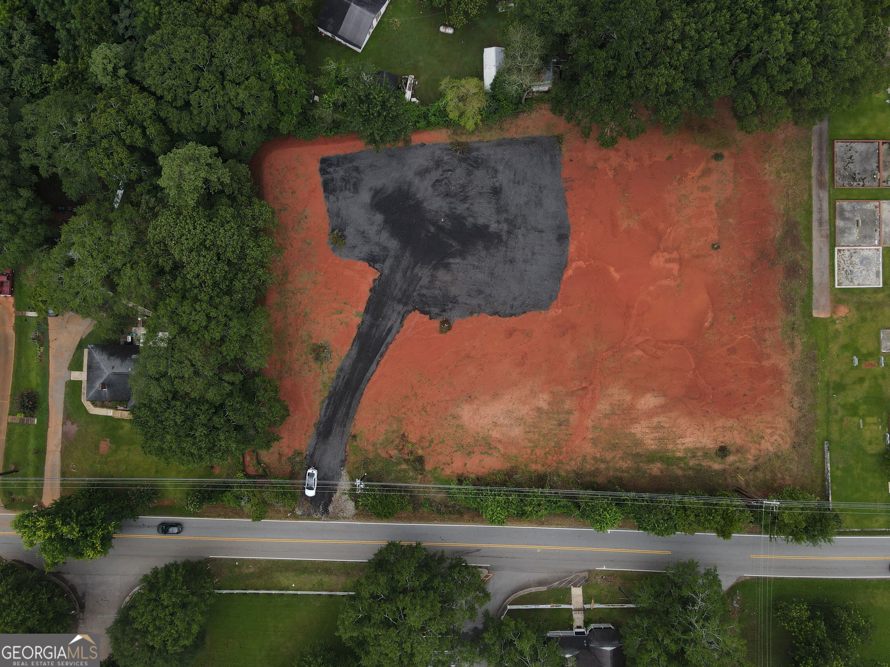 This prime 1.74-acre parcel. It is located on a high-traffic corridor with C-1 Neighborhood Commercial zoning, offering a wide range of development opportunities. The lot is vacant with no existing structures. Has excellent visibility and road frontage along Jodeco Road. Just 0.9 miles from I-75. 20 minutes to Hartsfield-Jackson Atlanta International Airport. 30 minutes to downtown Atlanta. Minutes from Eagles Landing shopping, restaurants, and healthcare facilities. Public utilities are available at the site, making it ready for development. Whether you're planning a retail center, office space, or service-based business, this location offers strong demographics, visibility, and convenience in one of Henry County's fastest-growing corridors.