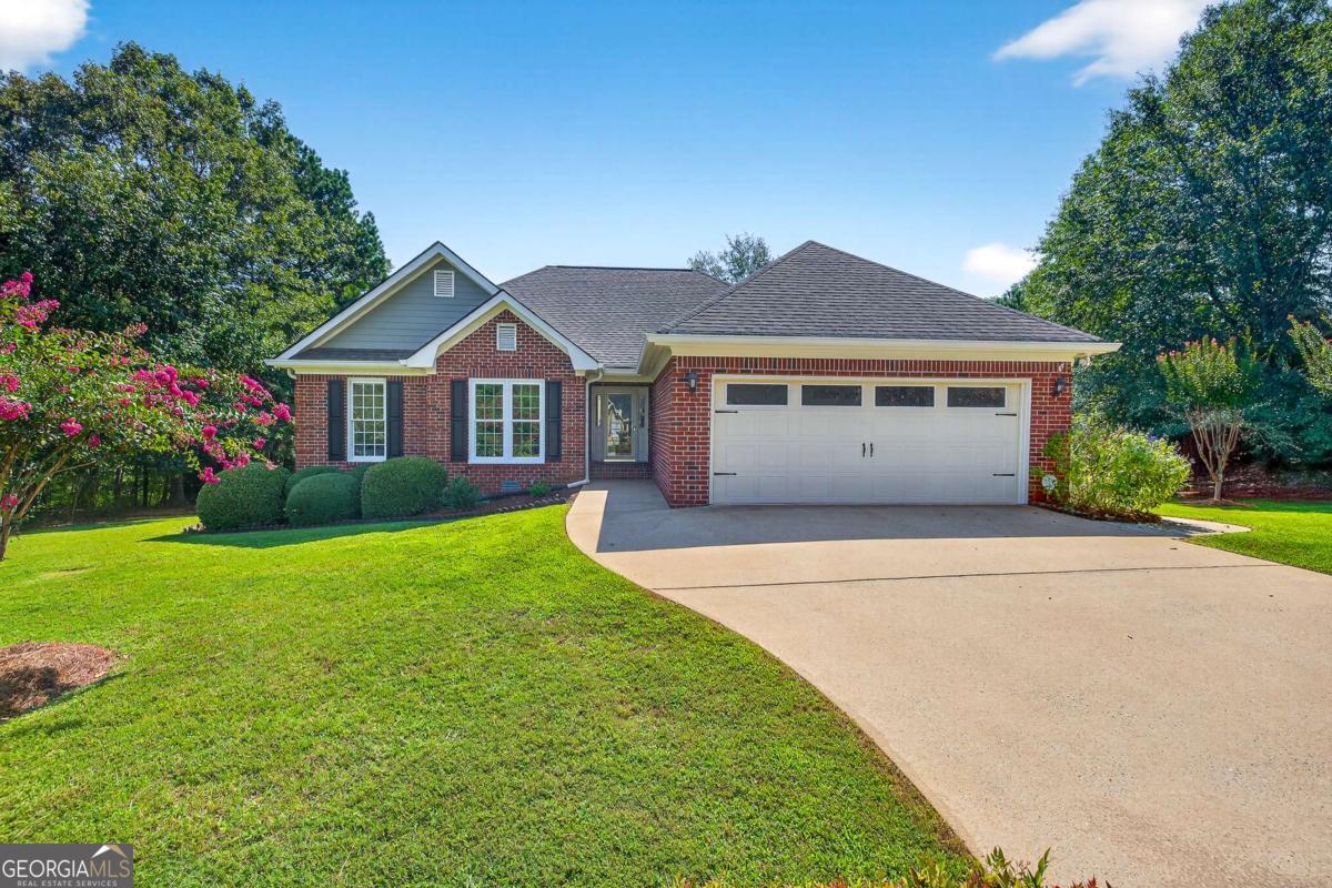 Welcome to Hampton Park! Nestled in one of Athens' most convenient neighborhoods, this charming 3-sided brick ranch offers the perfect blend of comfort, style, and practicality with a highly functional single-level floor plan. Enjoy a vaulted ceiling family room with cozy gas fireplace, 2-car garage, NEW exterior paint, and low-maintenance laminate/tile flooring throughout-no carpet! The open eat-in kitchen features SS apps, granite counters, pantry, and French doors leading to a spacious 15x15 side grilling patio. All 3 BRs reside on the main level, including a spacious owner's suite with tray ceiling, large closet, double vanity, garden tub, and separate shower. Relax at the rear deck overlooking a cul-de-sac lot with 3 sides of open yard space to roam! No mandatory HOA and unbeatable location-close to Loop-10, Normaltown, local dining, entertainment, and just 3 miles to the bright lights of Downtown Athens. Lovingly maintained and move-in ready-schedule your showing TODAY!
