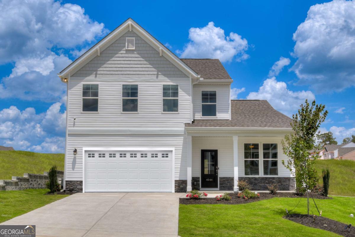 Welcome to Kinglsey at Lake Allatoona, the new Stanley Martin Community in Acworth, GA! LOT 48. Ask about the AMAZING builder Incentives available - Up to 3% or interest rate buy-downs In the Hollins floorplan, you can mix and mingle with friends and family in your open-concept first floor, which includes a kitchen overlooking the family room and dining area. A bedroom at the front of the home can be used for guests to have their own private space. The covered front porch or rear patio provide the perfect spot to relax and enjoy your new home. Upstairs, the Primary suite boasts ample space, including a large walk-in closet off the on-suite bathroom with double vanities, walk-in shower and separate soaking tub. Additional bedrooms provide the perfect place for family or friends to rest their heads at night. Plus, take the chore out of doing the laundry with a conveniently located laundry room on the upper level! *Photos shown are of a similar home**