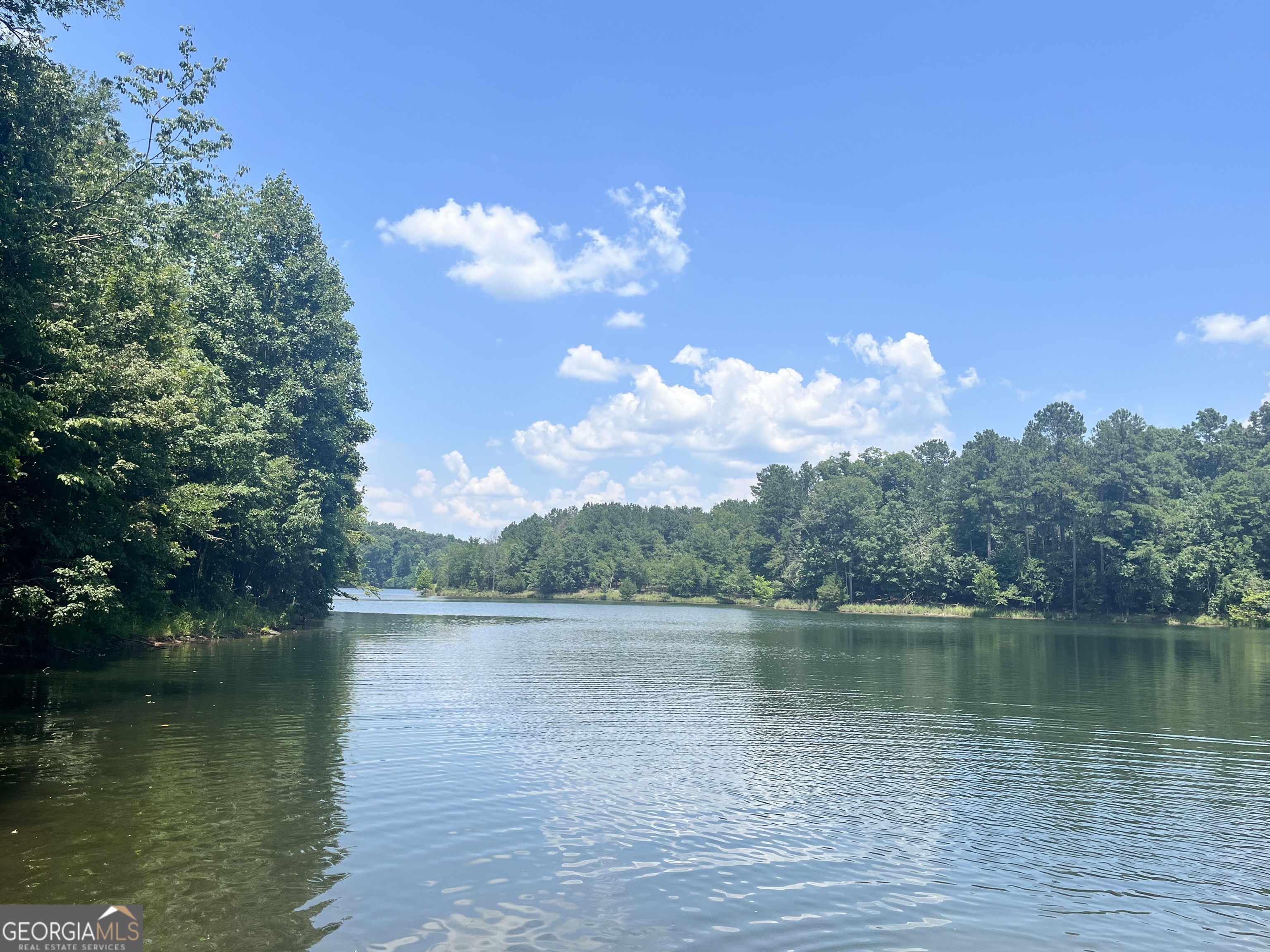 Discover your private oasis with this breathtaking 18.25-acre wooded estate lot, nestled just a short ways from a pristine public access reservoir lake. Enveloped by towering trees and lush greenery, this expansive parcel offers unparalleled tranquility and endless possibilities for your dream home, retreat, or recreational haven.
