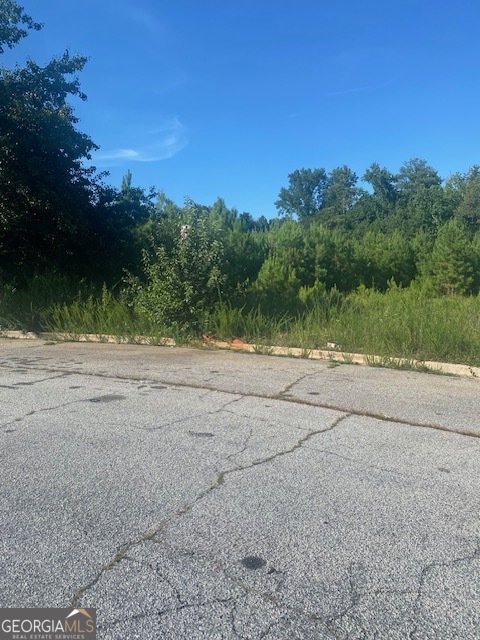 PRIME COMMERCIAL ZONED 3.92 ACRES OF LAND. THE EXACT ZONING IS GVUV, WHICH MEANS GATEWAY VILLAGE/URBAN VILLAGE. THIS CAN ACCOMMODATE A VARIETY OF BUSINESES. LOCATED OFF THE BUSY HIGHWAY 138, RIGHT BEHIND BANK OF AMERICA. OTHER BUSINESSES NEARBY INCLUDE CHICK-FIL-A, TMOBILE, STARBUCKS, BURGER KING, PEP BOYS, LA FITNESS, PLANET FITNESS AND ALOT MORE. DON'T MISS THE OPPORTUNITY TO OWN THIS PRIME PIECE OF REAL ESTATE IN THE FAST DEVEOPING CITY OF CONYERS. ONLY 30 MINUTES FROM ATLANTA.