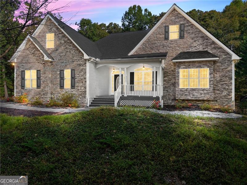 Welcome to this beautiful 4-bedroom, 3-bathroom ranch home complete with its own private saltwater pool and pool house-all at an unbeatable value! Perfectly located just minutes from Lake Lanier, the North Georgia Premium Outlets, and all the outdoor recreation, dining, and shopping Dawsonville has to offer along GA-400. Step inside to an inviting open floor plan where the spacious family room greets you with a gorgeous view of the sparkling pool. The home features pristine hardwood floors throughout the main living areas, adding warmth and elegance. The kitchen offers generous counter and cabinet space, along with a direct view to the backyard oasis-ideal for both everyday living and entertaining. The owner's suite boasts tray ceilings and a spa-inspired bath with a large vanity, walk-in shower, and separate soaking tub. Two additional bedrooms on the main level provide plenty of comfort, while the large bonus room/bedroom upstairs-fully heated and cooled-offers flexible space for guests, a media room, or a home office. Outdoors, enjoy the resort-style backyard with a covered patio, poolside pergola, and a solar-heated saltwater pool for extended seasonal enjoyment. The detached pool house includes a kitchenette and versatile leisure space-perfect for entertaining, relaxing, or working from home. And for added peace of mind, the home comes with an HVAC system that's only 3 years old. Don't miss this unique opportunity to own your own private retreat in the heart of Dawsonville. Schedule your showing today!